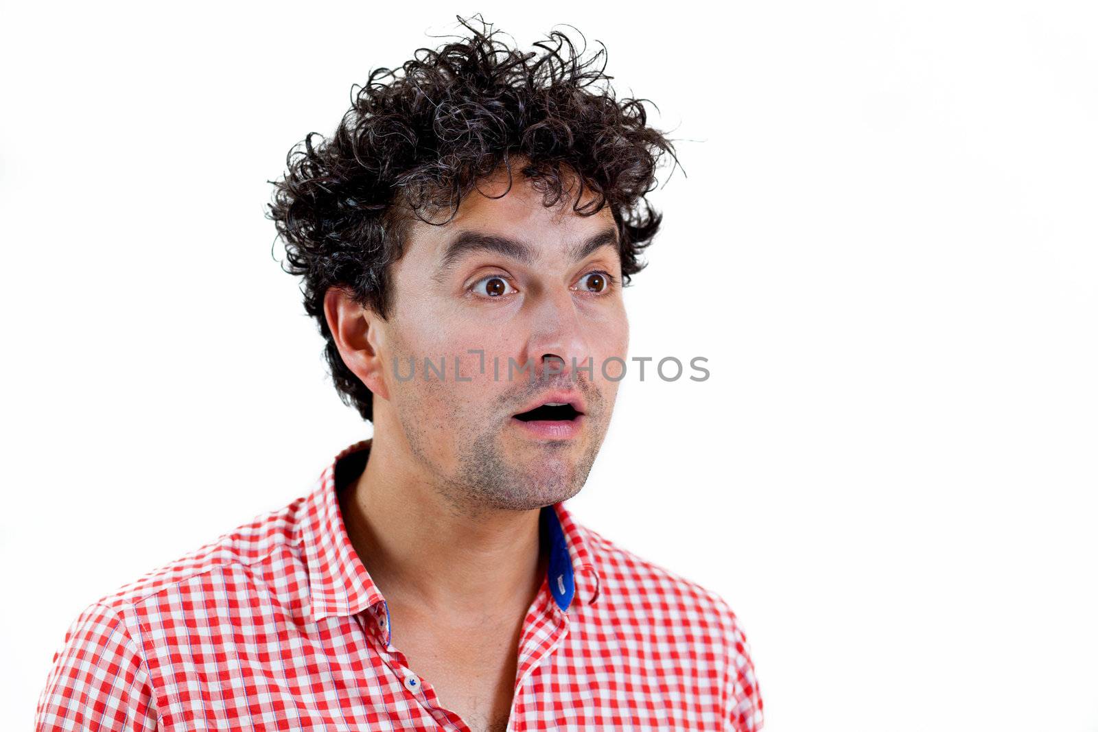 Young man very surprised, isolated on white background