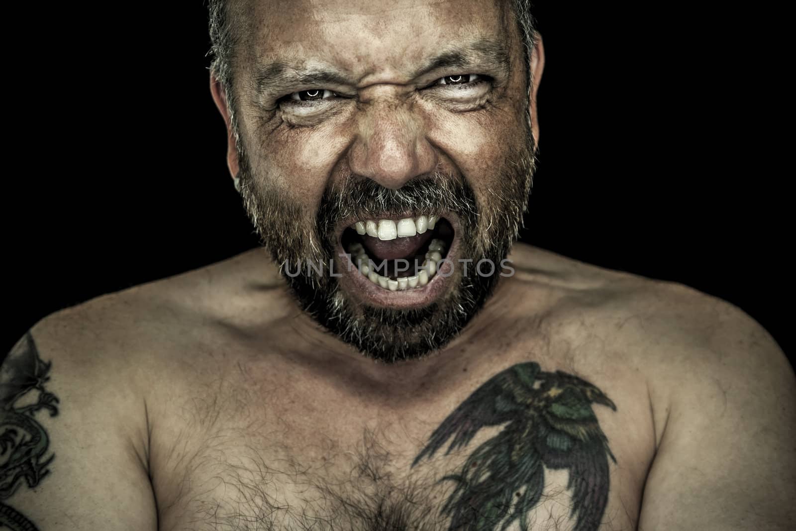 angry man with beard by magann