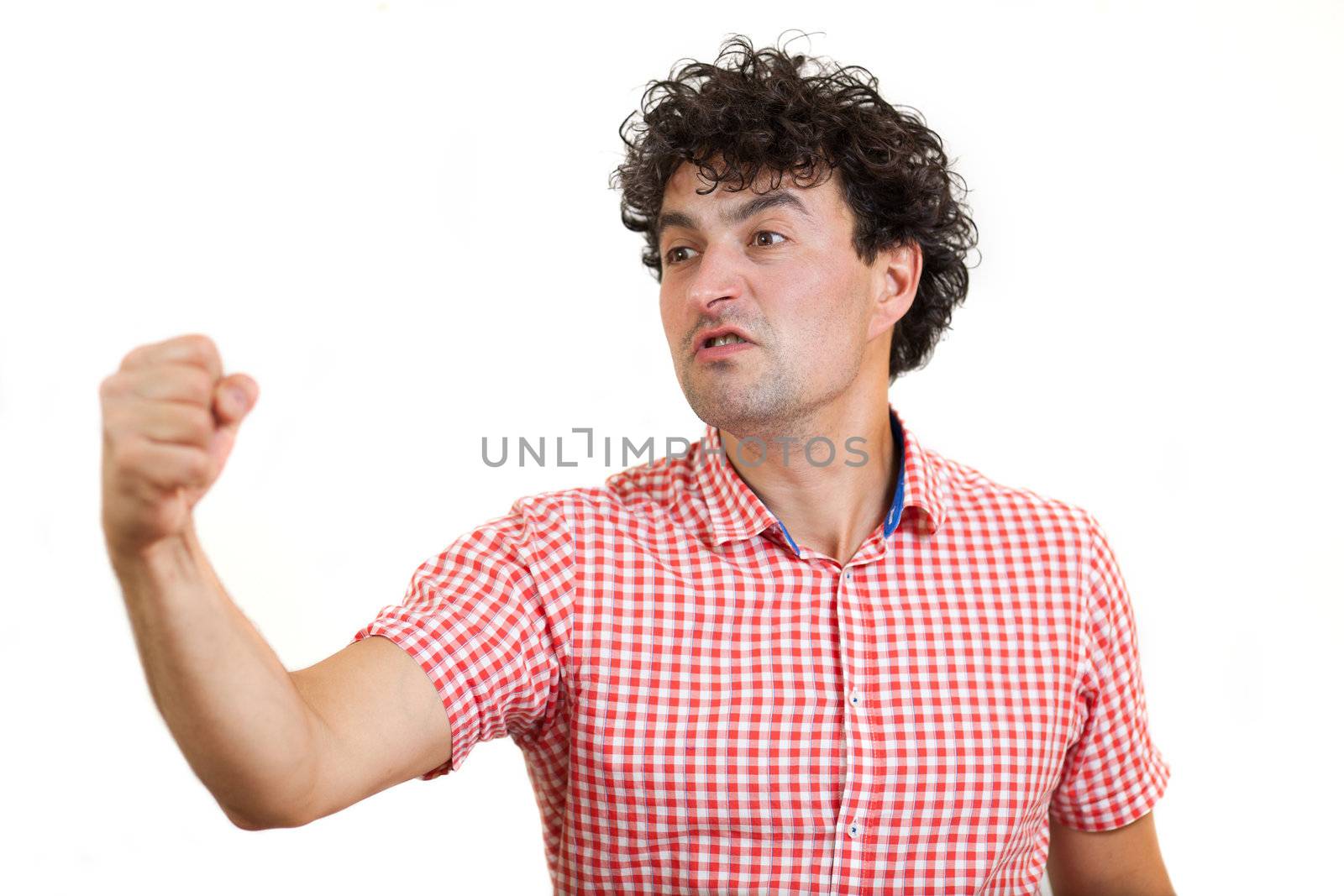 Aggressive young man showing his fist, isolated on white background 