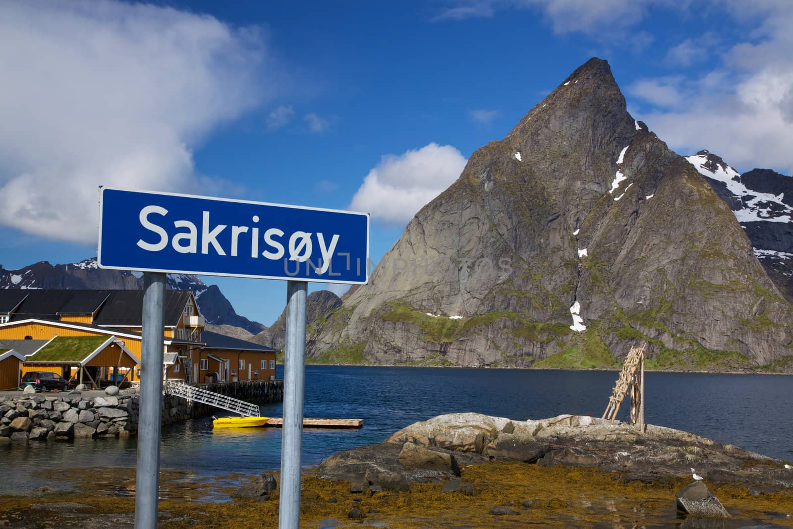 Village of Sakrisoy with traditional yellow fishing harbor on Lofoten islands in Norway