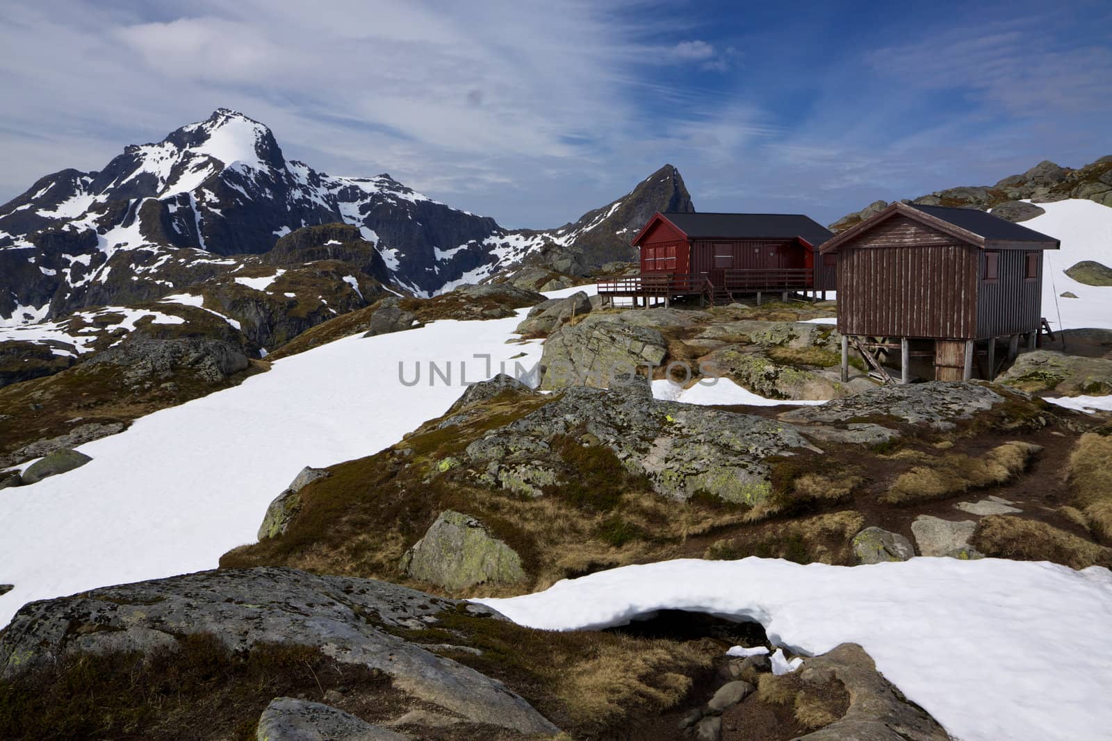 Picturesque highest peaks on Lofoten islands in Norway with mountain hut