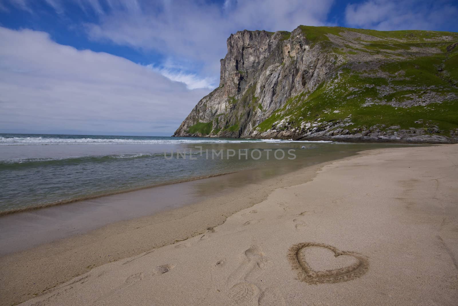 Symbo lof love in the sand on a picturesque beach on Lofoten islands