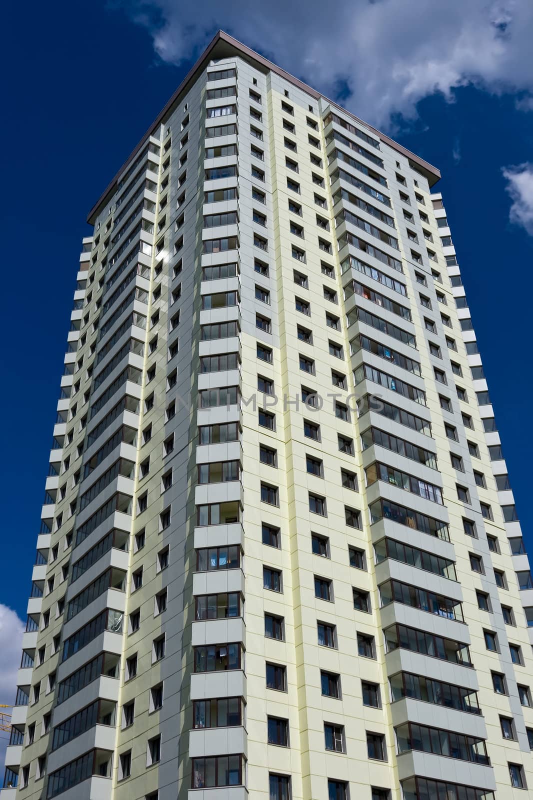 Modern apartment building under blue sky