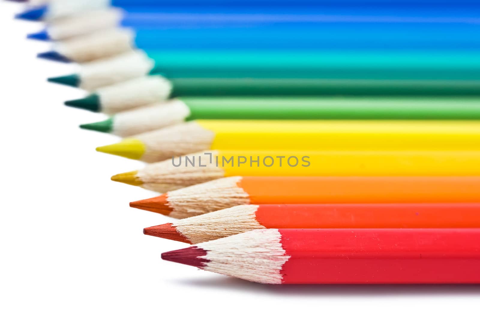 Coloured pencils with shadow on white background