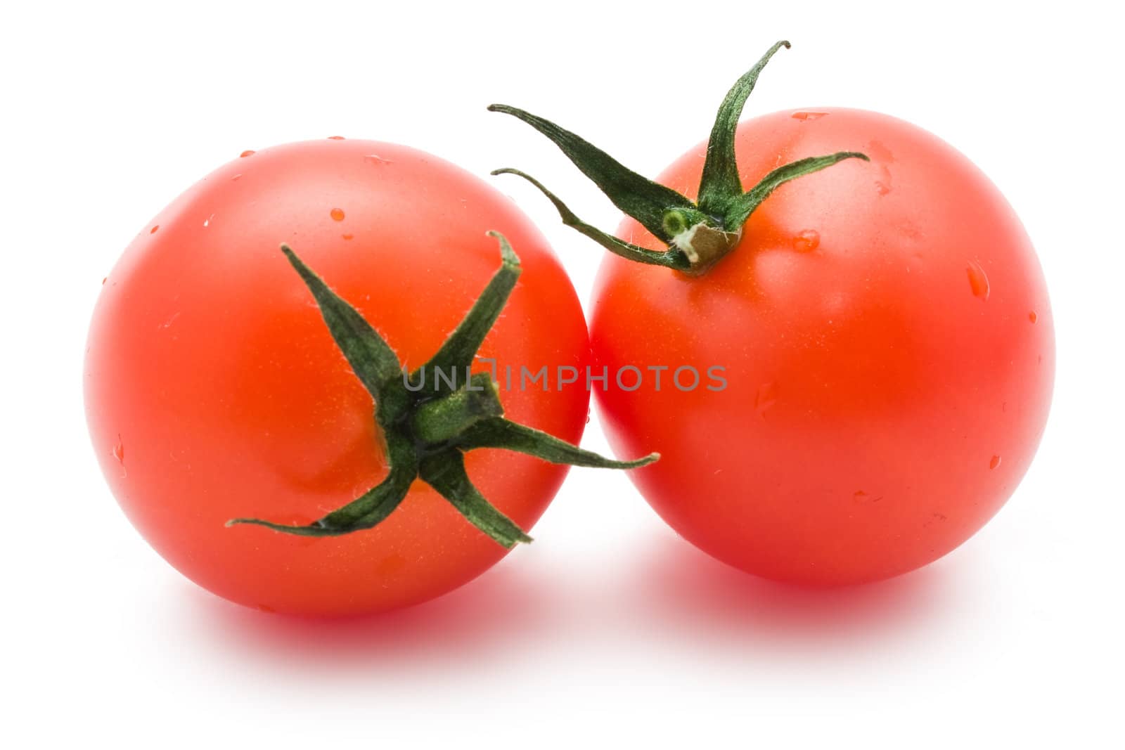 Fresh tomatoes isolated on white background
