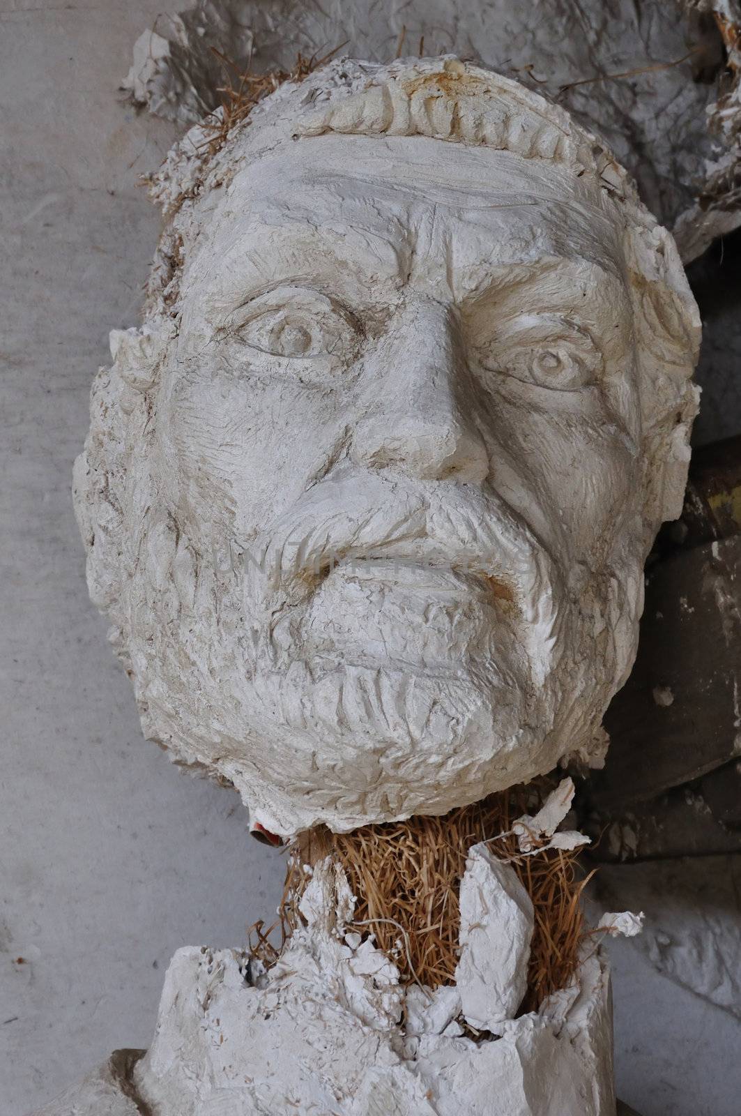 ATHENS - FEBRUARY 3: Plaster sculpture ancient god Zeus broken statue head in the abandoned studio of sculptor Nikolaos Pavlopoulos in Athens Greece, February 3, 2012.