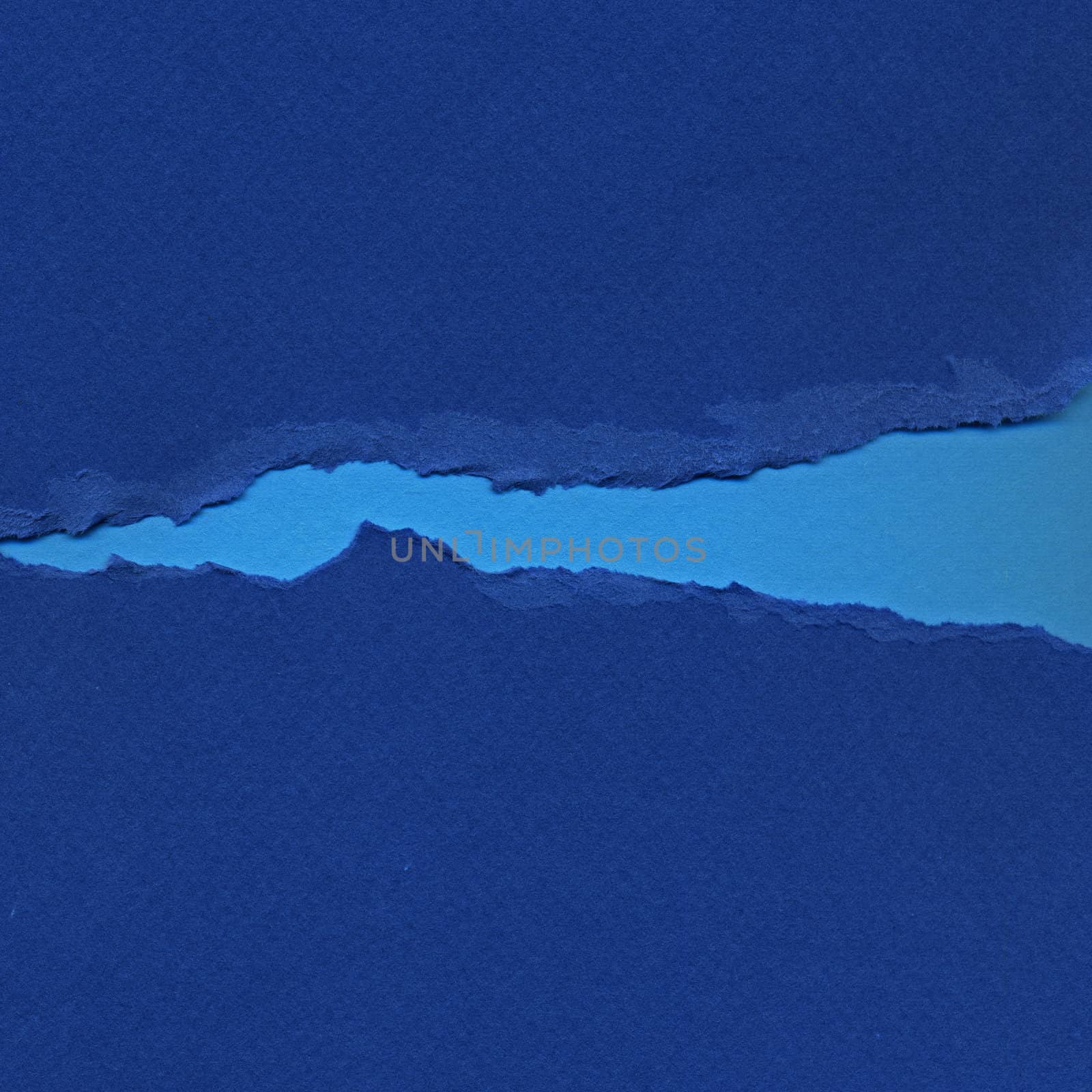 Torn blue paper background resembling flowing river. Grunge design element.