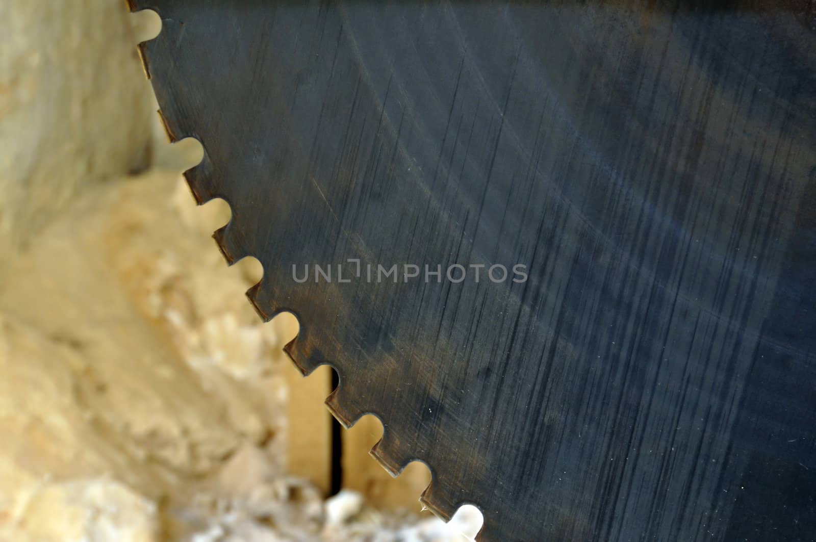 Rusty cutting wheel cylinder. Vintage saw blade industrial equipment macro.