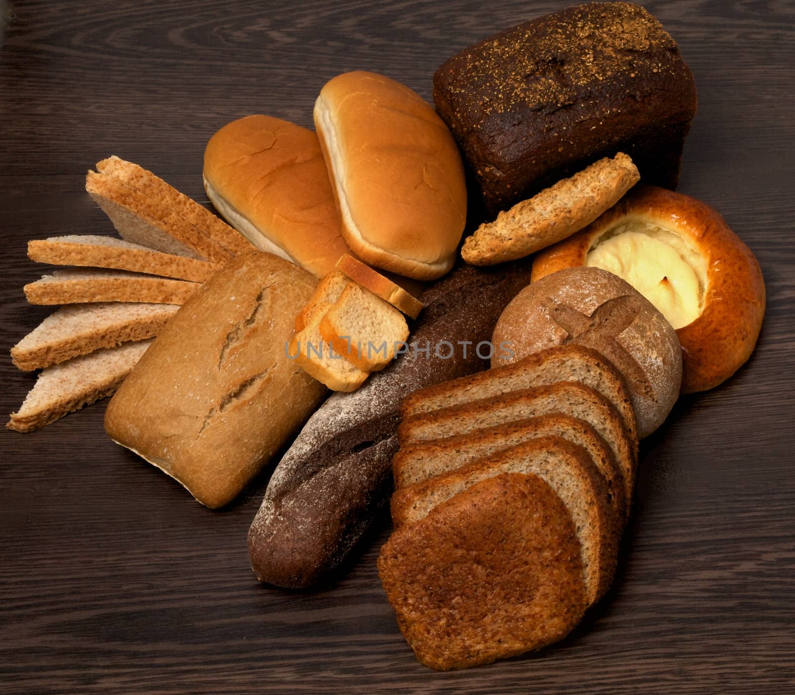 Top View of Various Bread on Wooden background