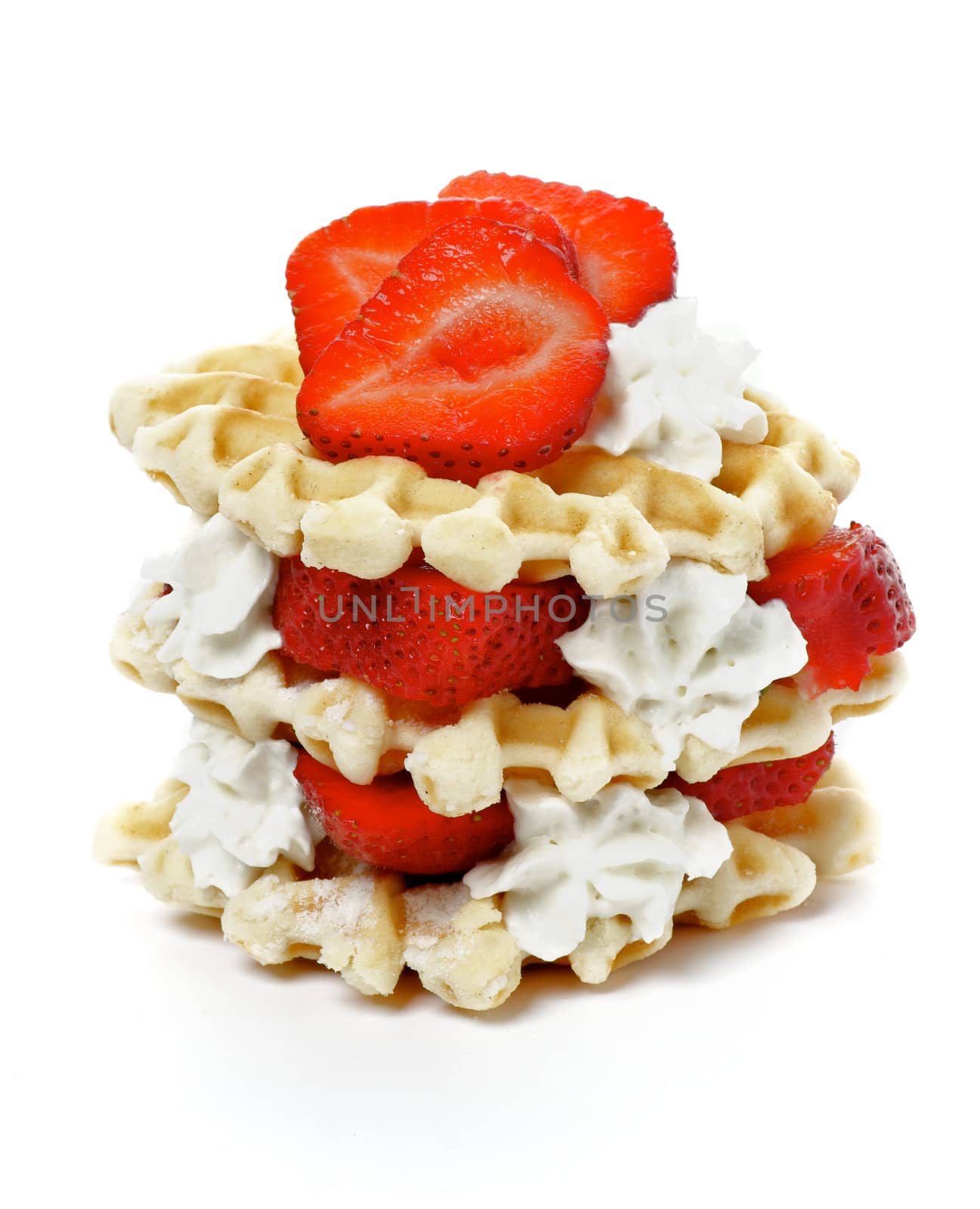 Waffles with Strawberries and Whipped Cream isolated on white background