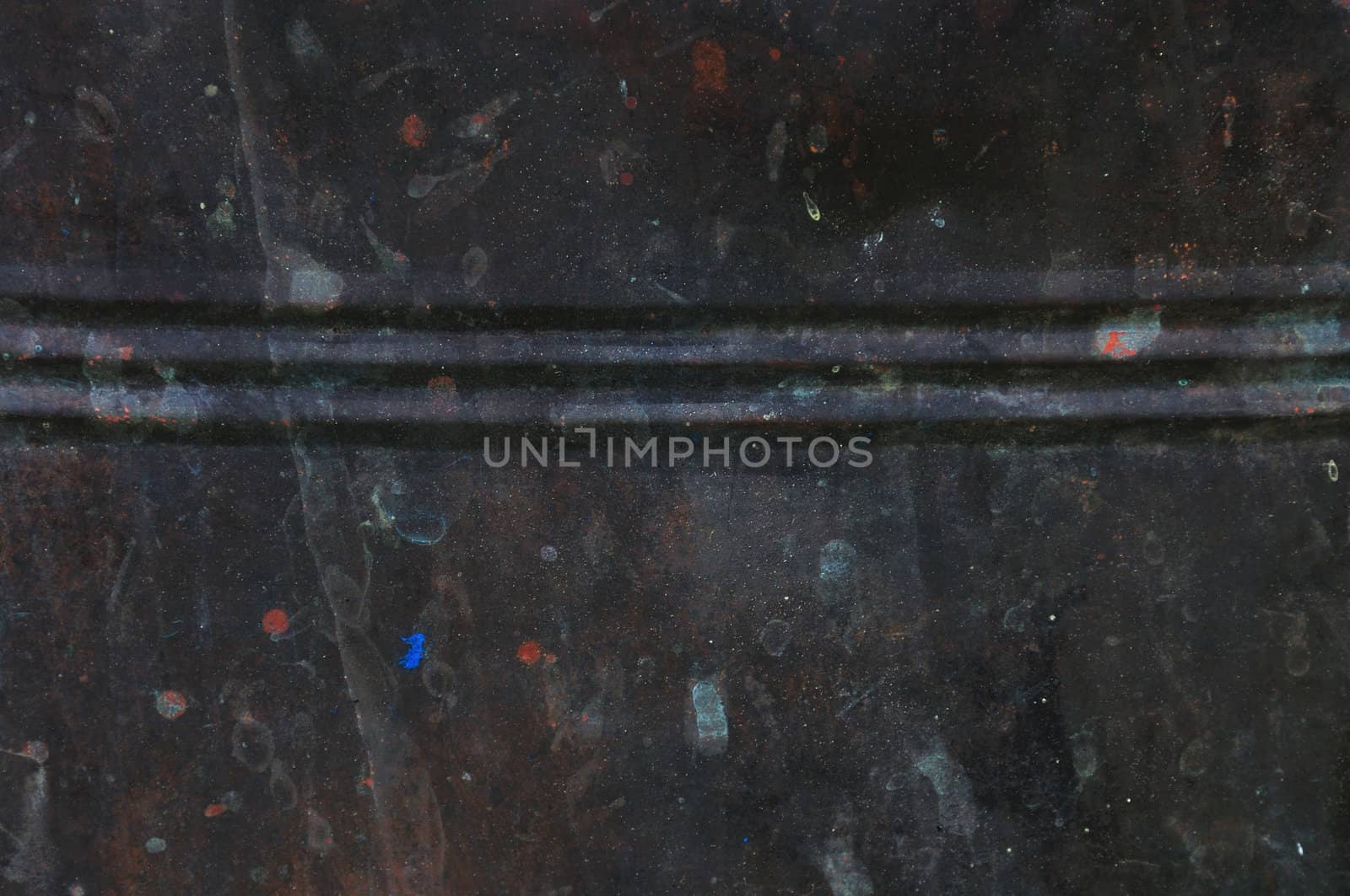 Rusty black barrel background. Paint stained metal texture.