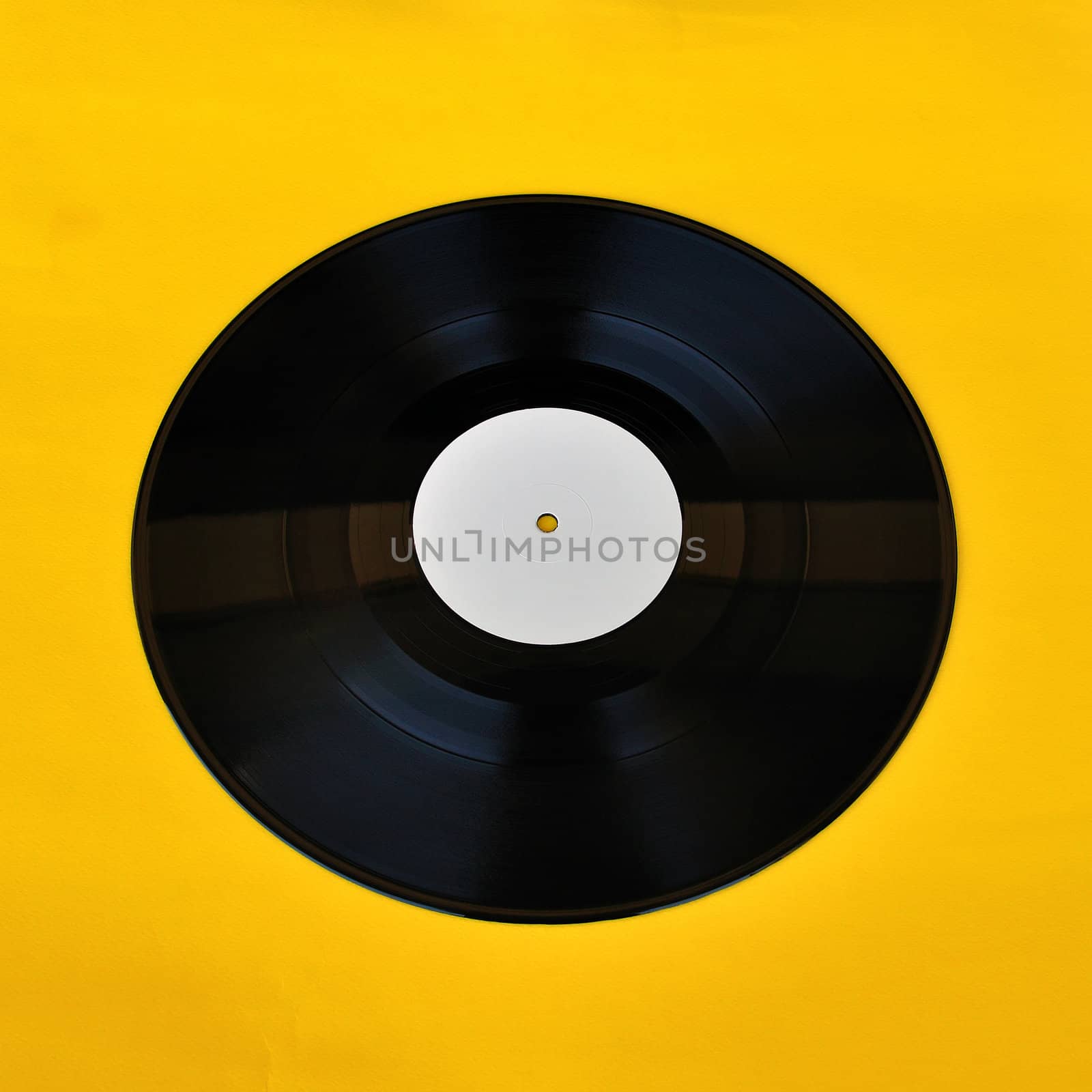 Vinyl record white label promo on yellow background. Music and audio.