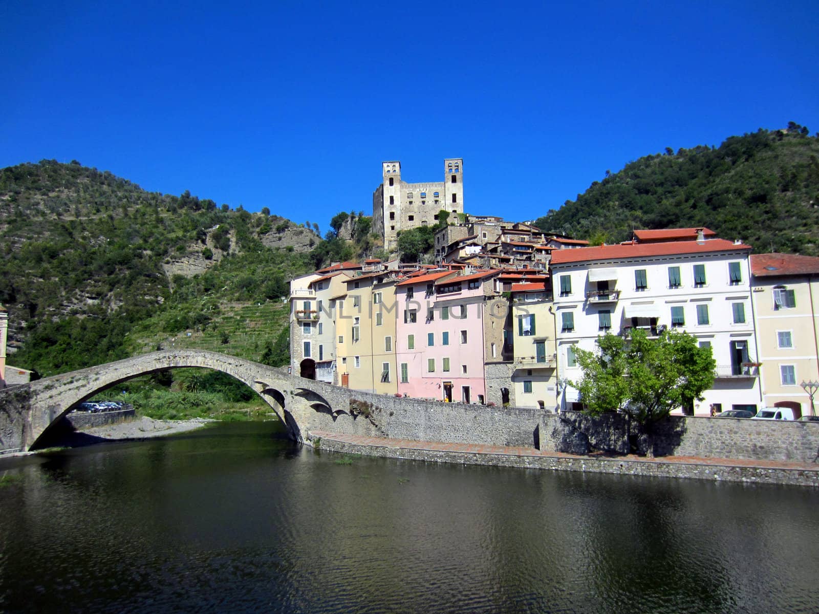 Village with castle and roman stone bridge