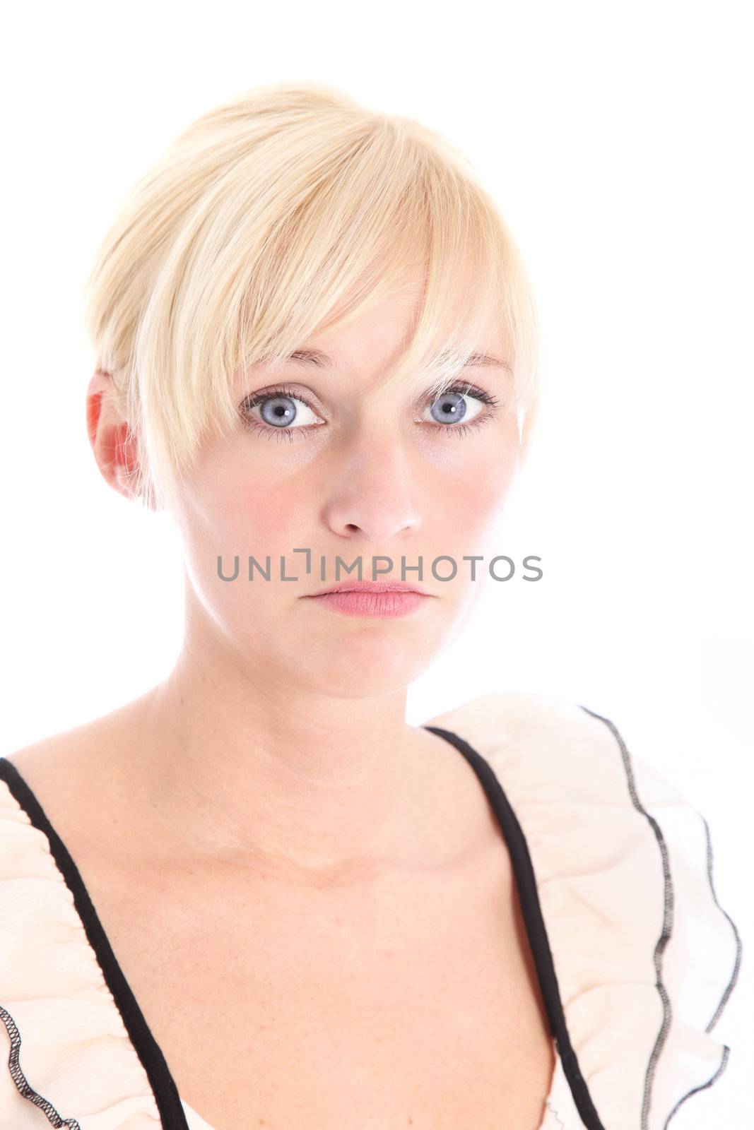 Sad woman with large doleful eyes and downturned mouth looking at the camera isolated on white Sad woman with large doleful eyes and downturned mouth looking at the camera isolated on white