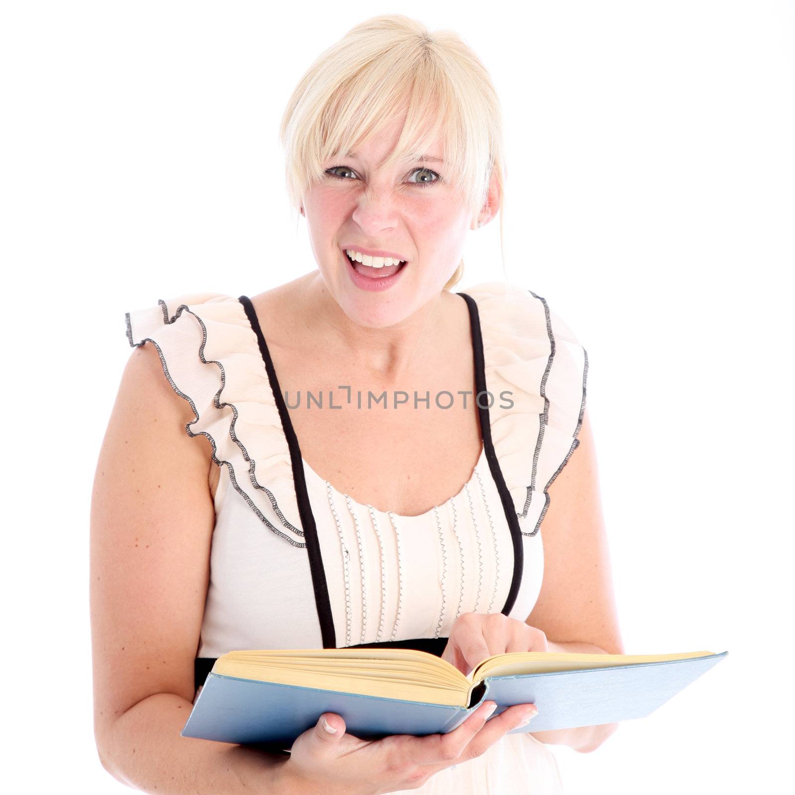 Woman with bemused expression looking something up in a book she is handholding isolated on white Woman with bemused expression looking something up in a book she is handholding isolated on white