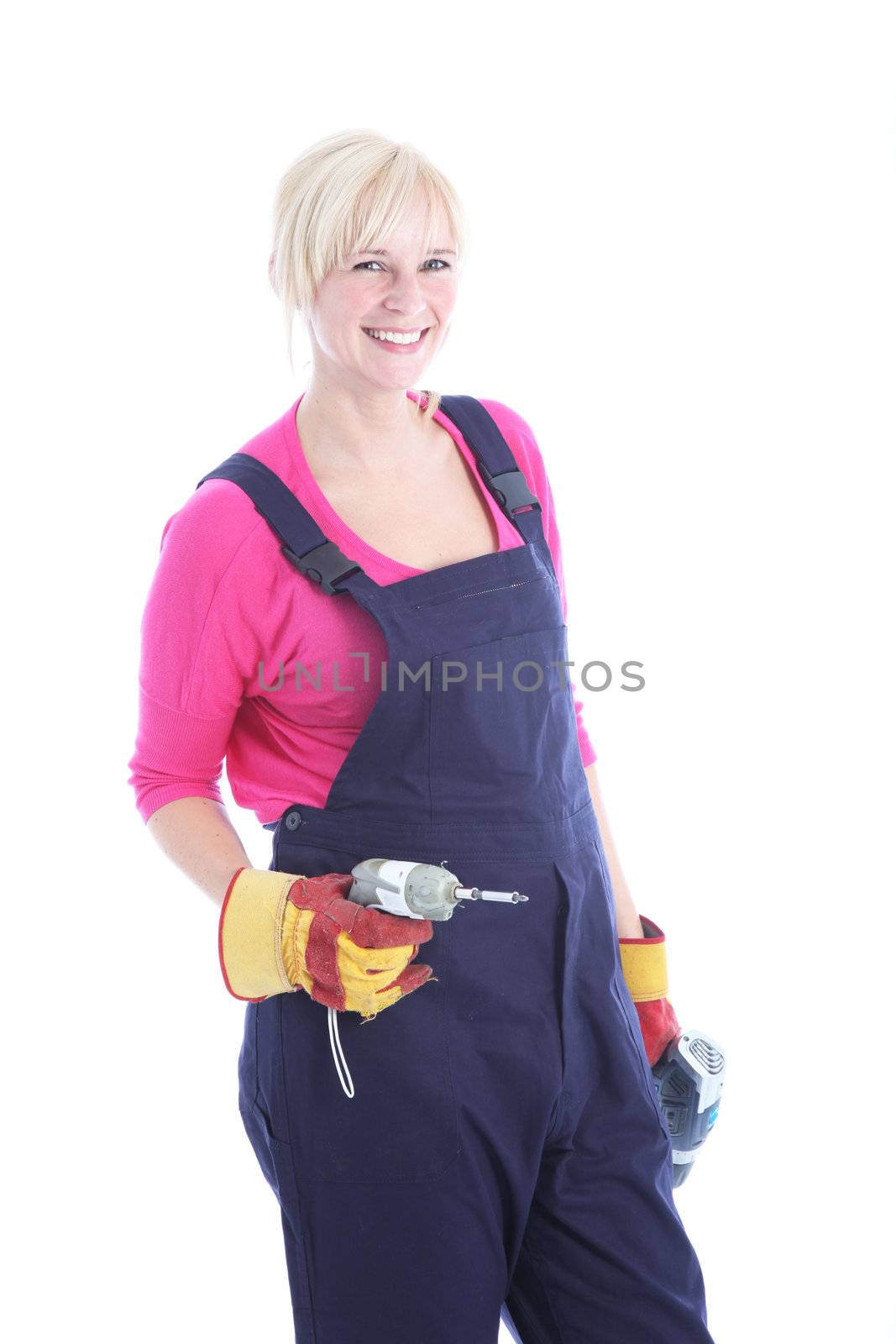 Studio shot of smiling female worker with a drill isolated on white 