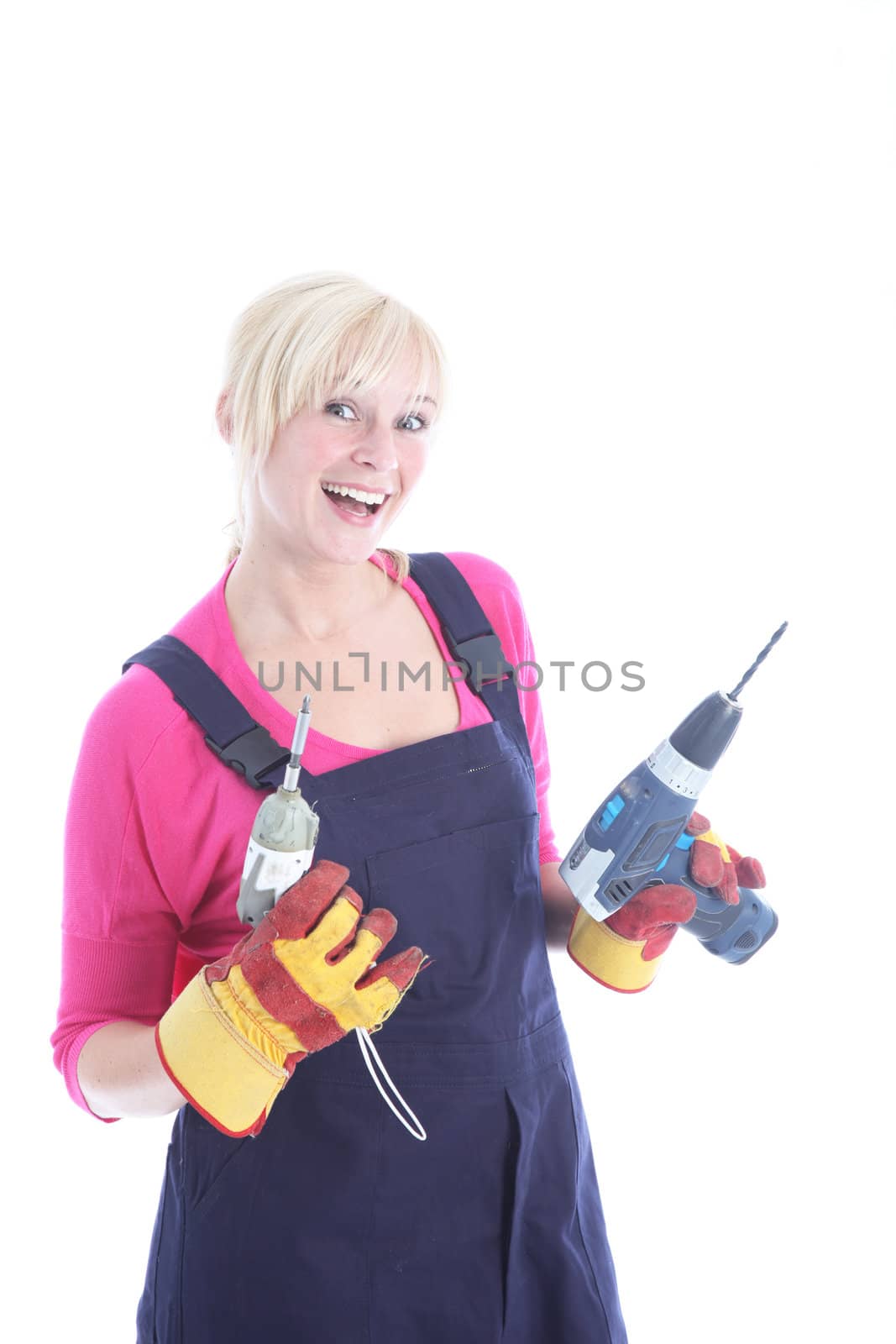 Joyful female worker holding two drills isolated on white Joyful female worker with two drills isolated on white