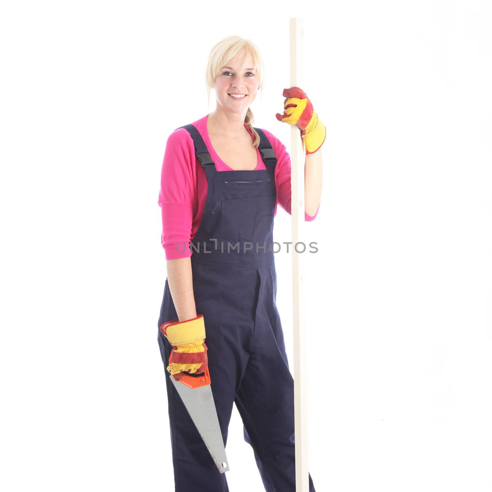 Attractive female worker with a saw isolated on white Attractive female worker with a saw isolated on white