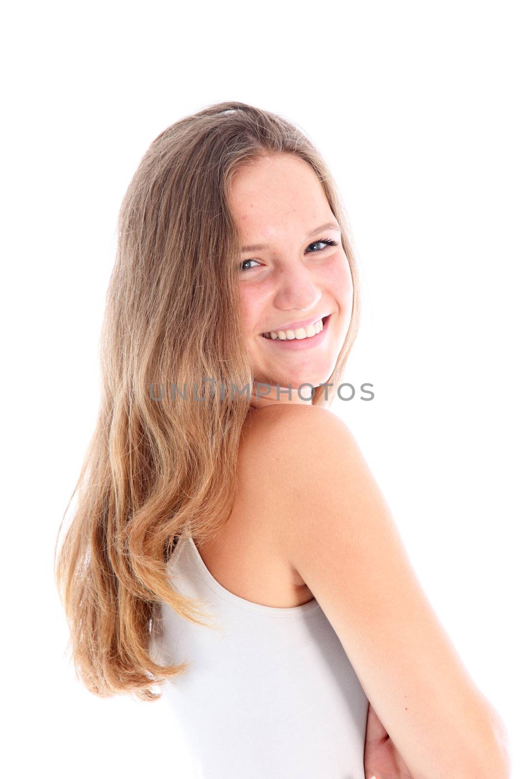 Happy friendly teenager standing sideways and smiling at the camera over her shoulder isolated on white Happy friendly teenager standing sideways and smiling at the camera over her shoulder