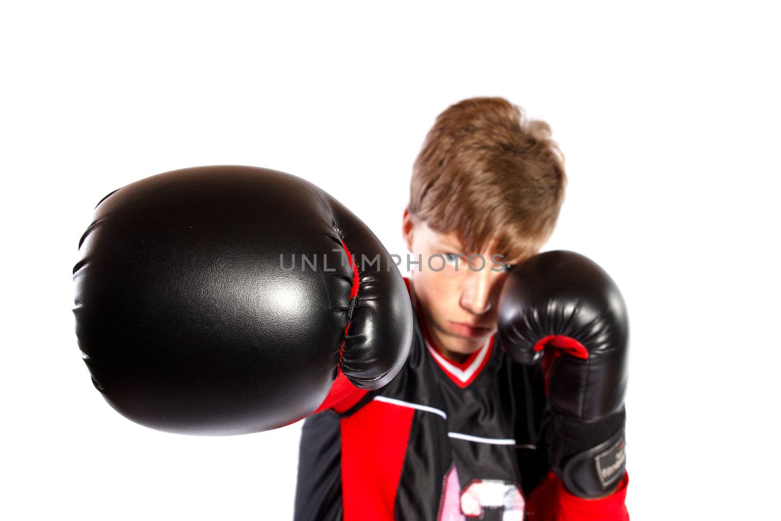 young kickboxer on white background, focus on the glove