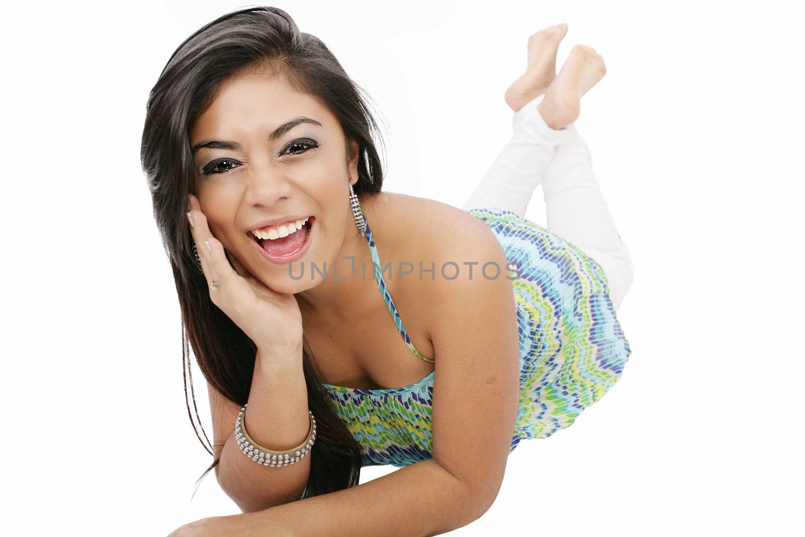 smiling young woman lying on the floor isolated on white background
