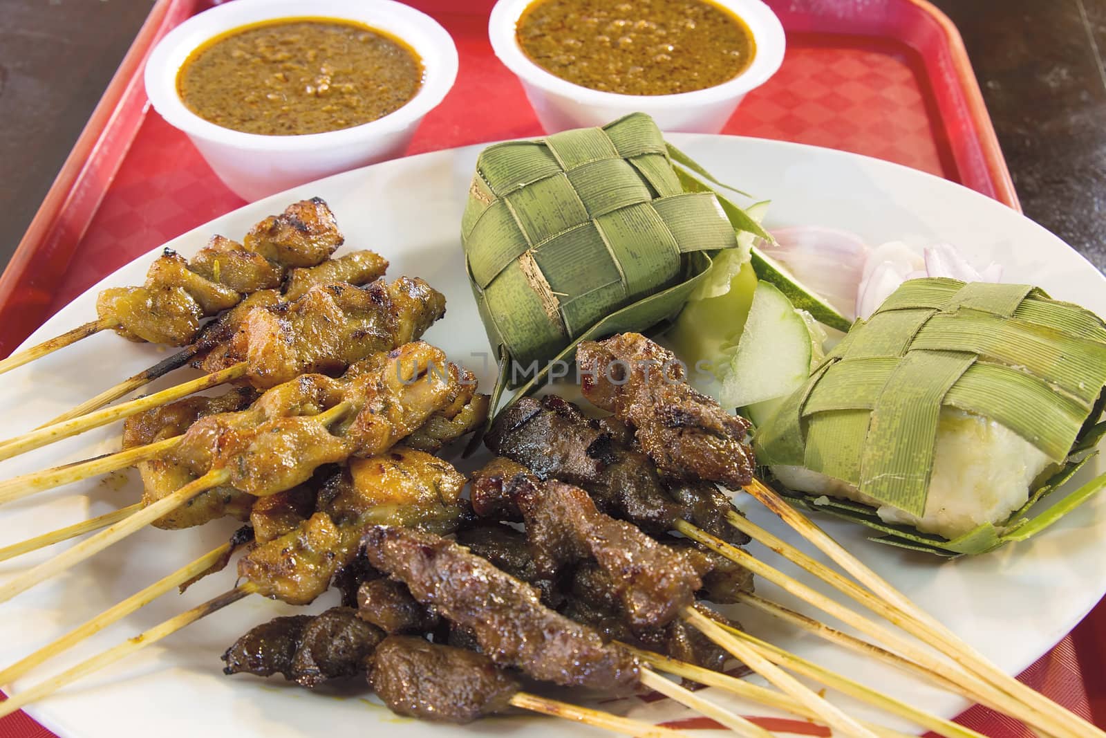 Chicken Beef and Mutton Satay with Ketupat and Peanut Gravy Sauce Closeup