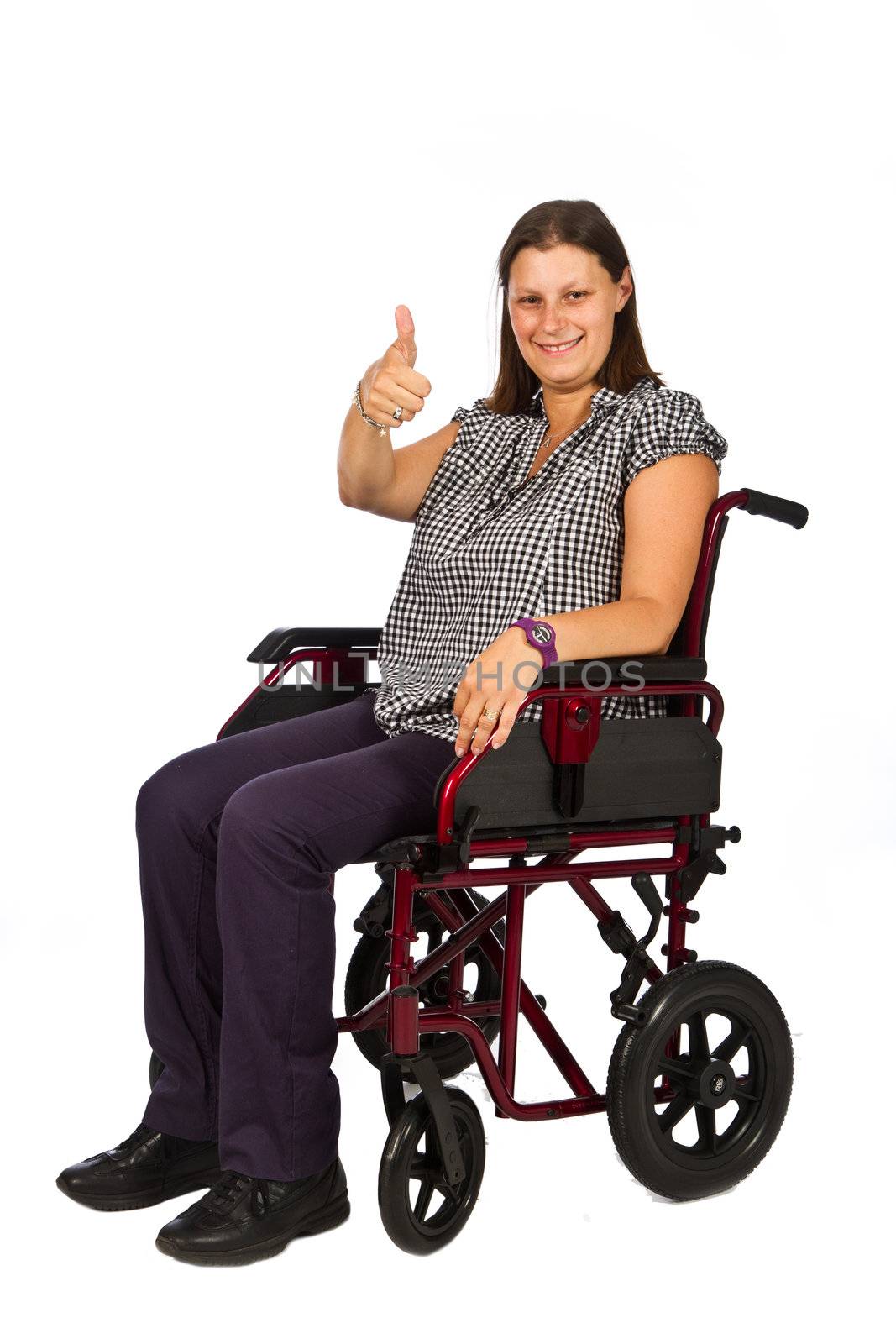 Cute young girl smiling in wheelchair