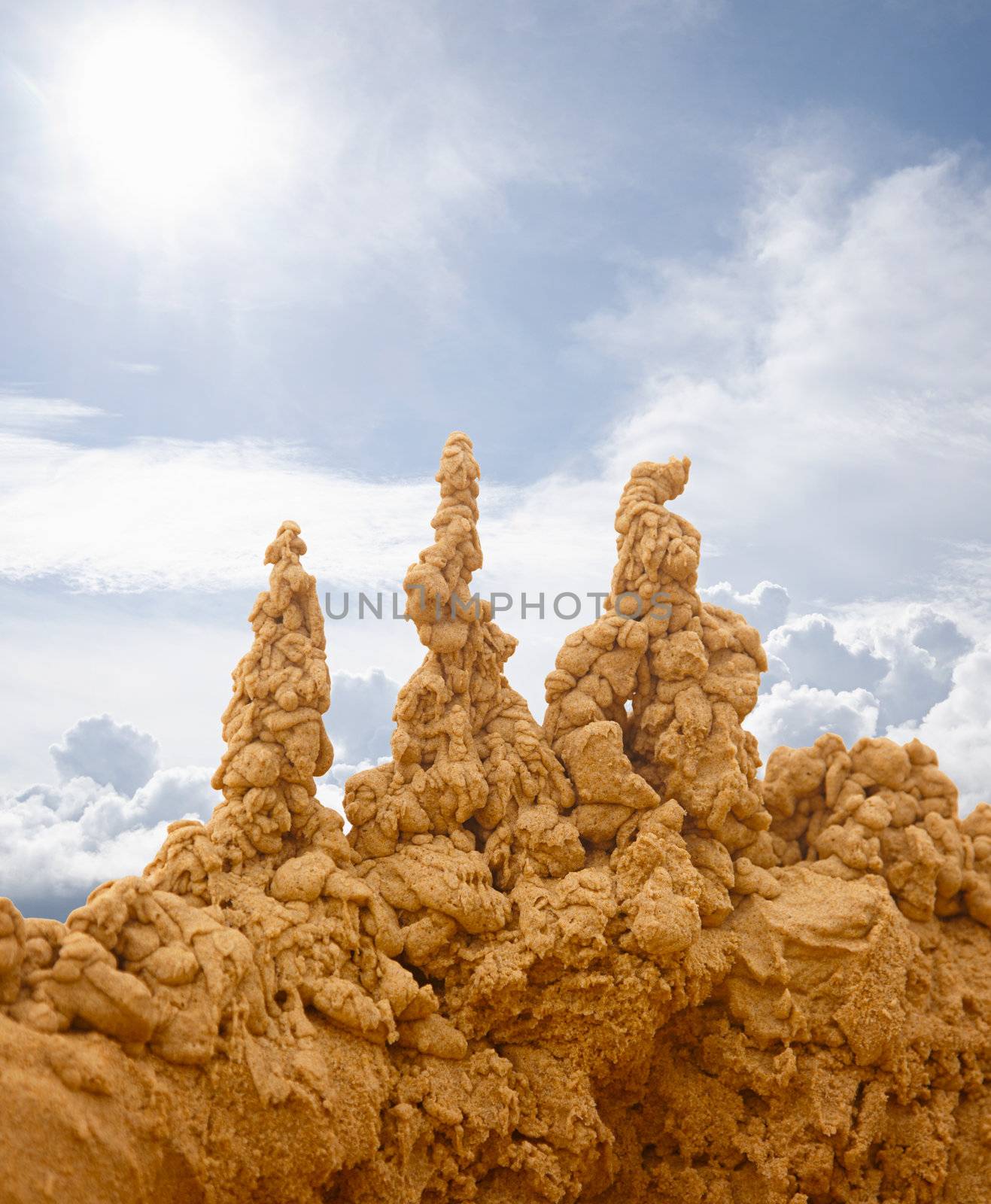 Bizarre sand castles on the sky background