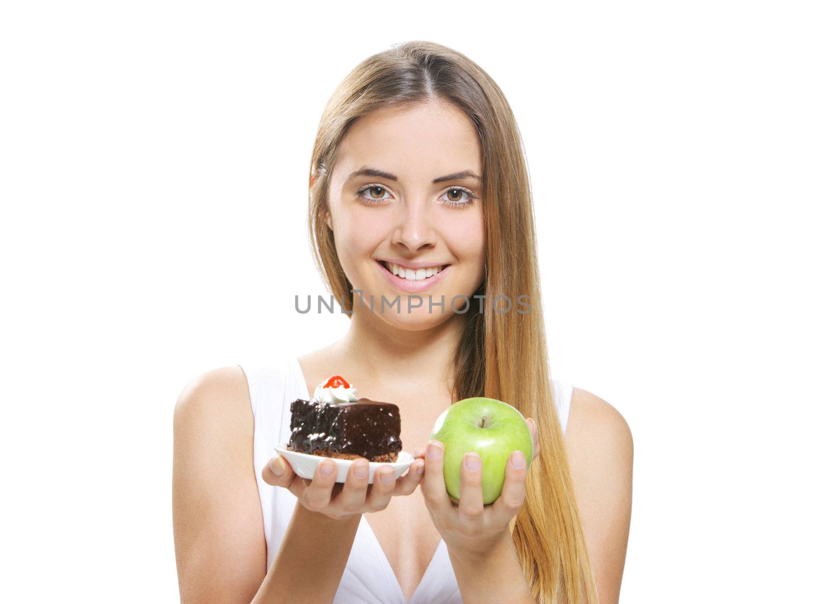 diet concept:  Woman choosing between fruits and cakes