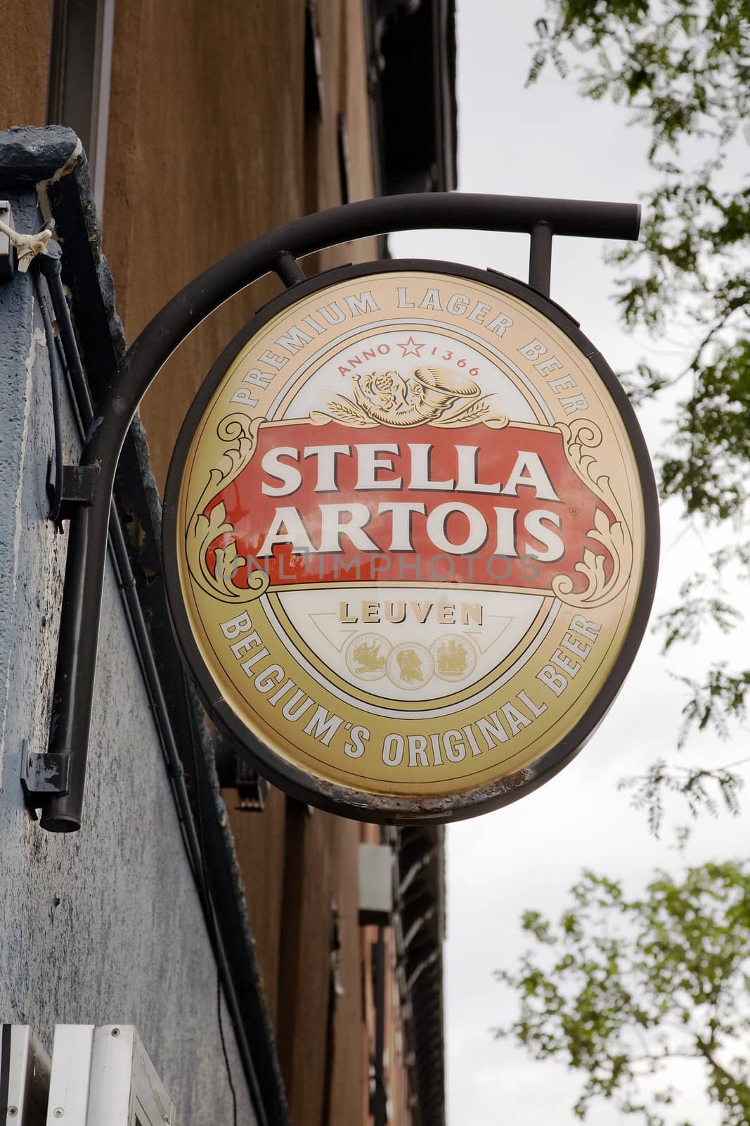 Sign advertising Belgian beer Stella Artois hanging outside a bar.