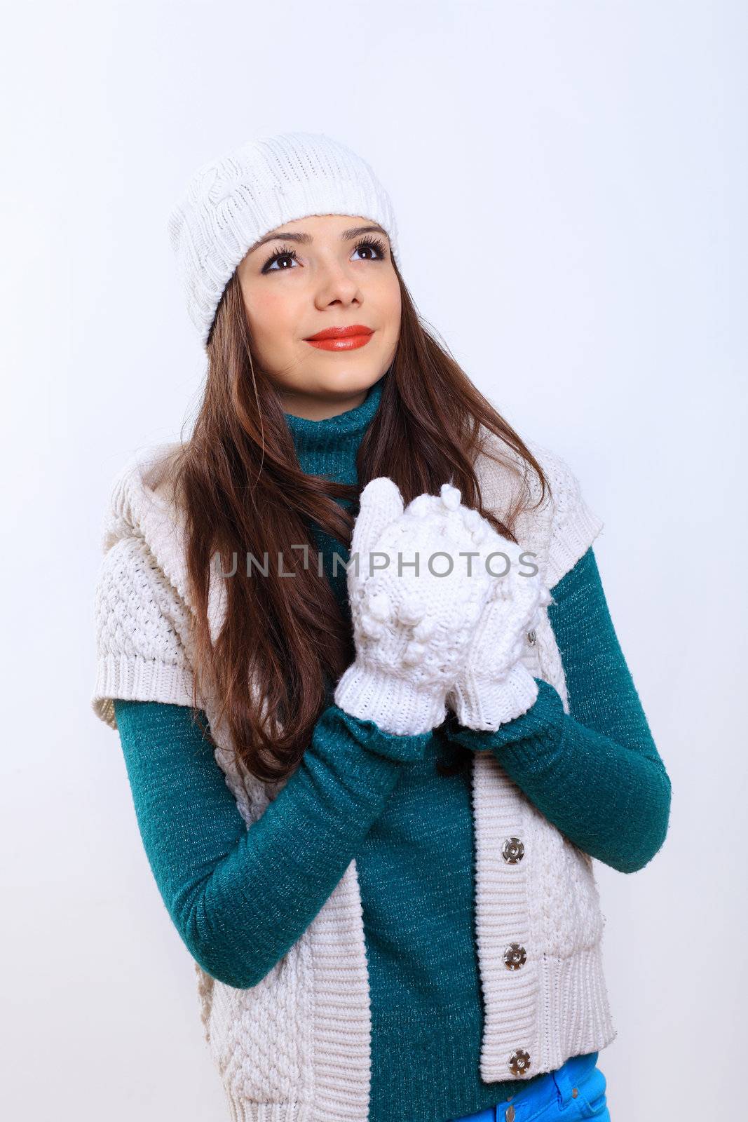 Young woman wearing winter hat and warm scarf by sergey_nivens