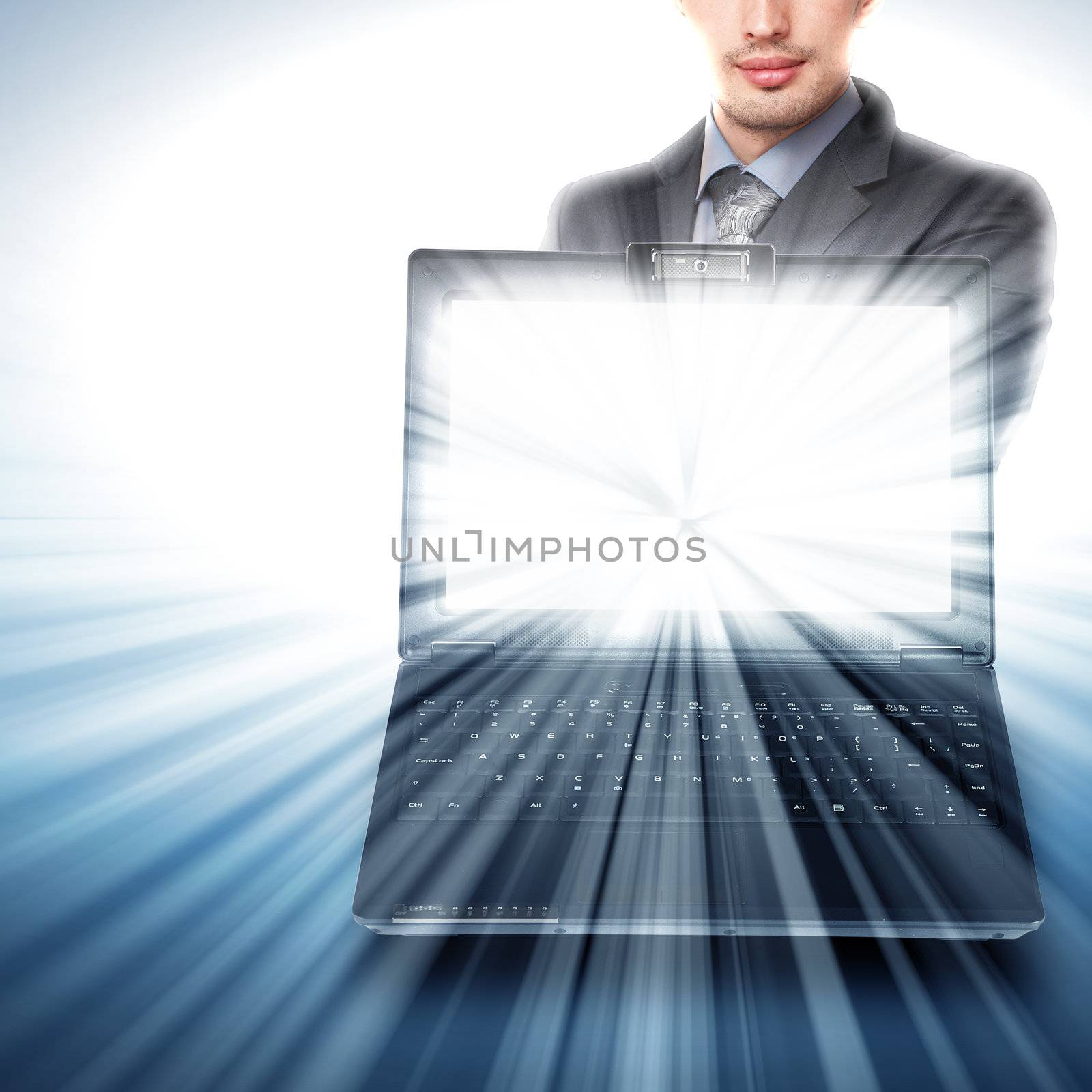 Image of notebook with shining screen and light