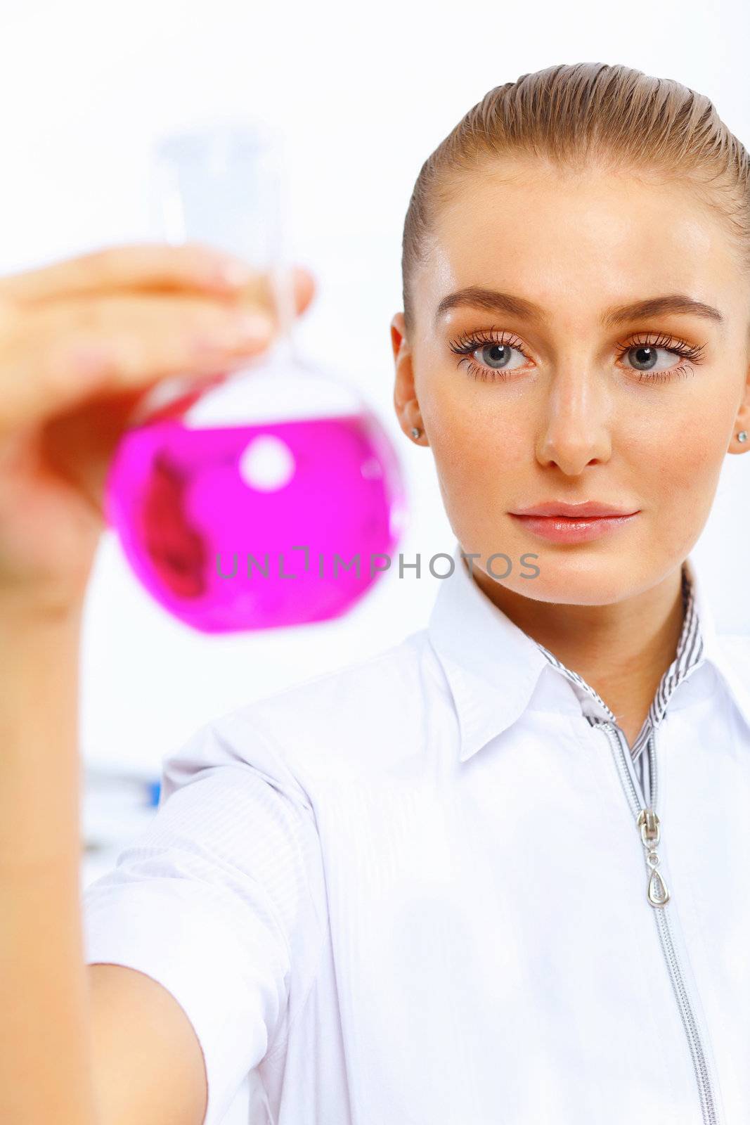 Young female scientist working in laboratory by sergey_nivens