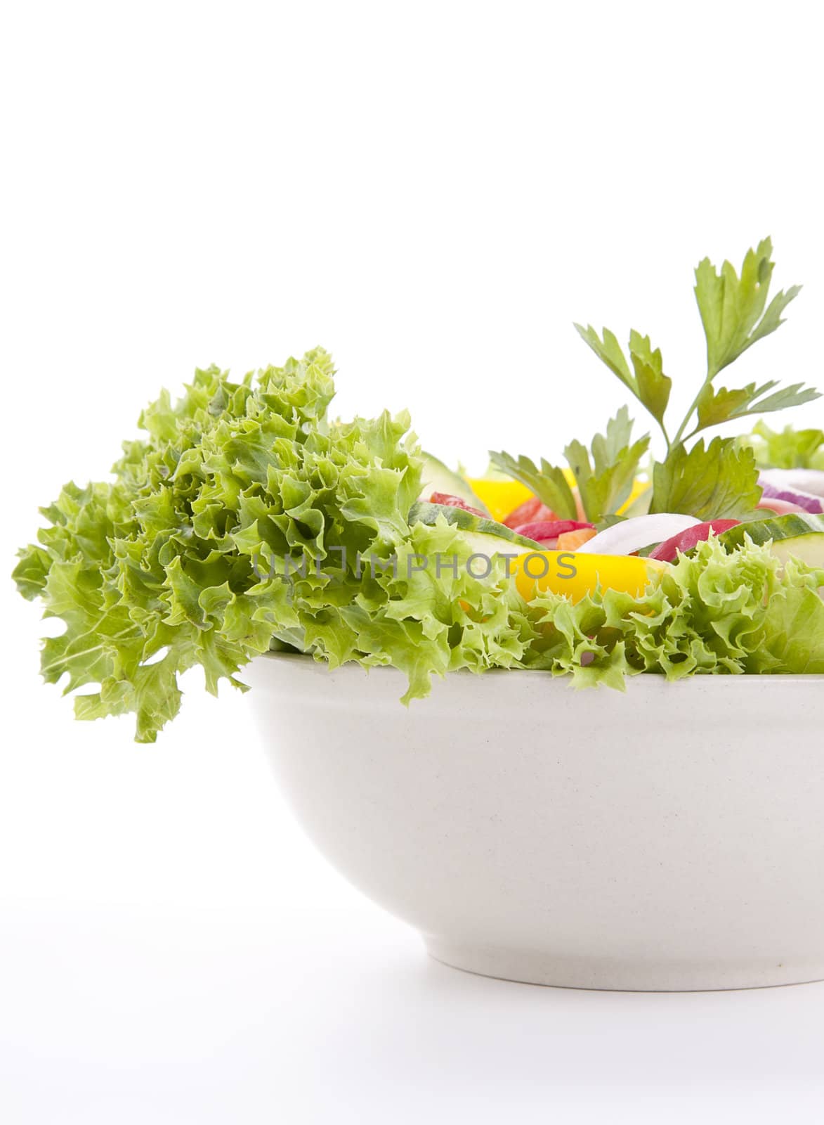fresh tasty healthy salad with different vegetables isolated on white background