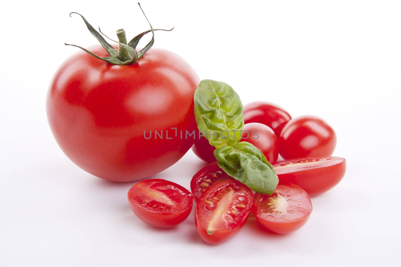 fresh red tomatoes with balsamic and oilve oil isolated on white background