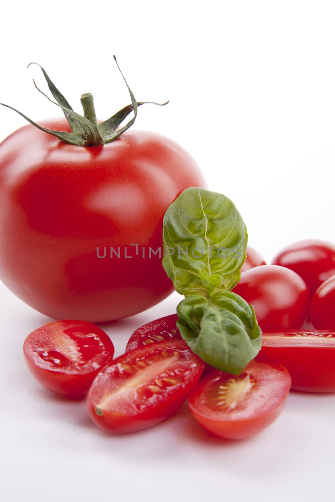 fresh red tomatoes with balsamic and oilve oil isolated on white background