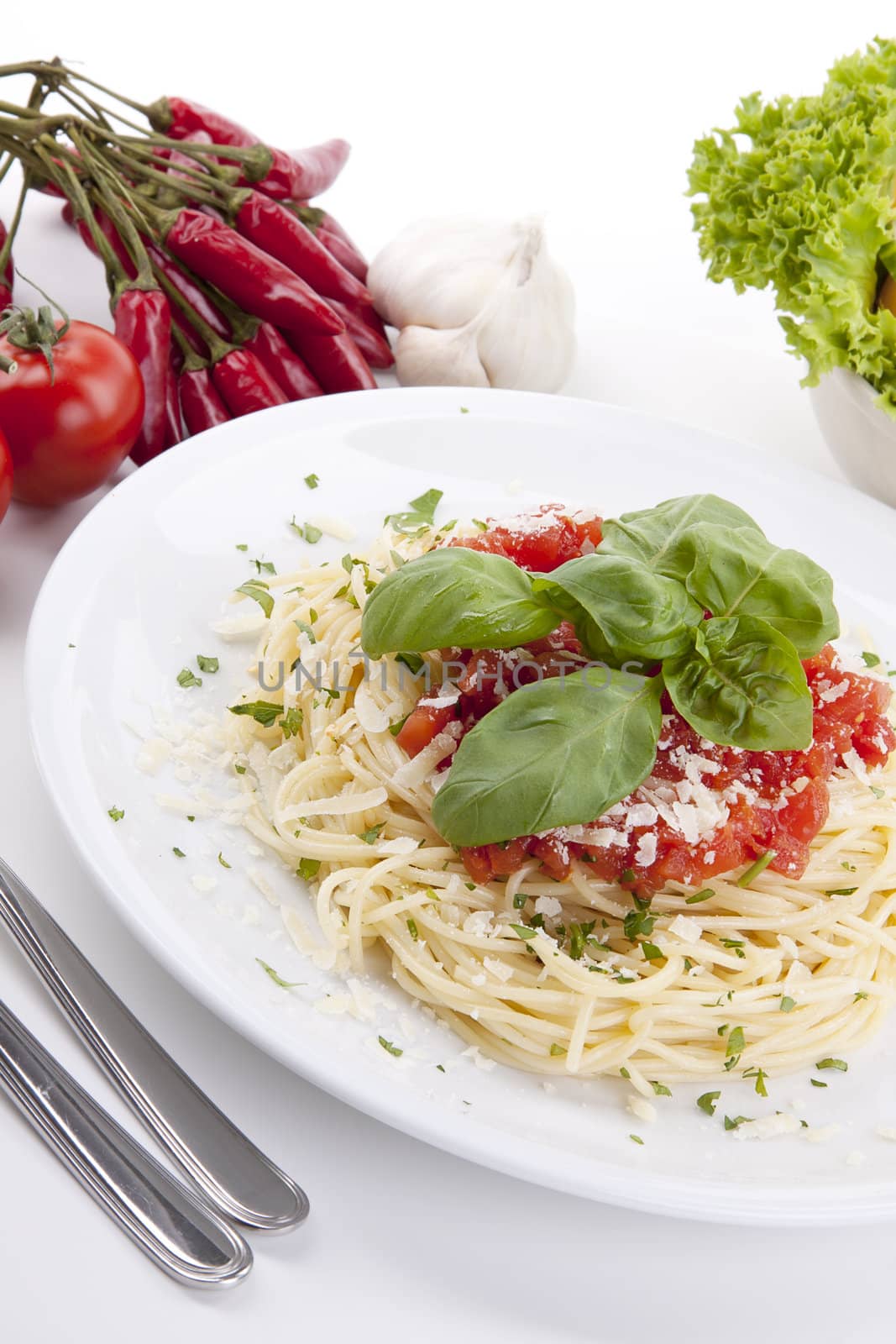 tatsty fresh spaghetti with tomato sauce and parmesan isolated on white background