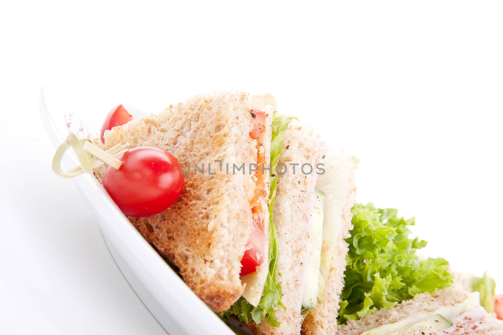 fresh tasty club sandwich with salad and toast isolated by juniart