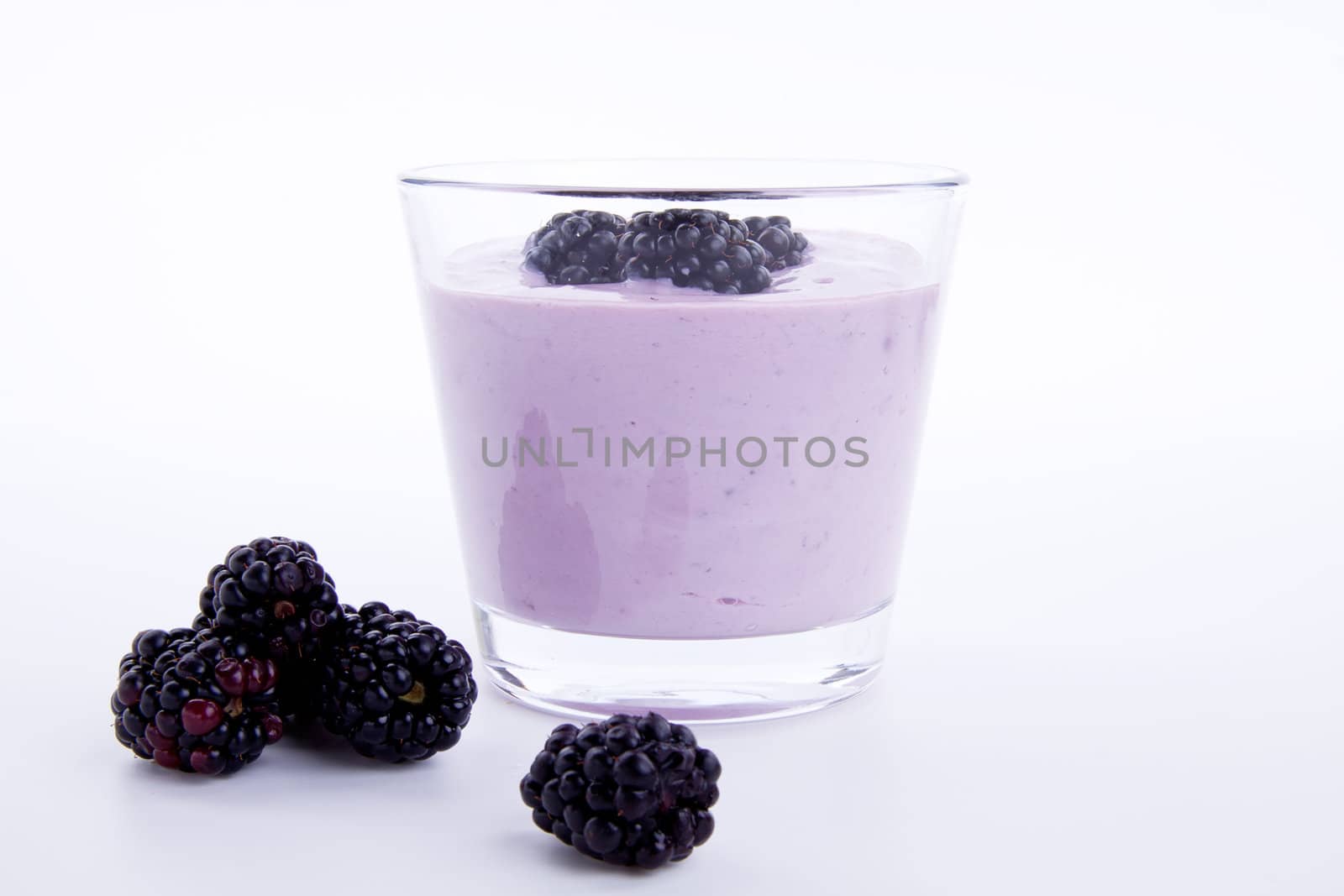 fresh tasty blackberry yoghurt shake dessert isolated by juniart