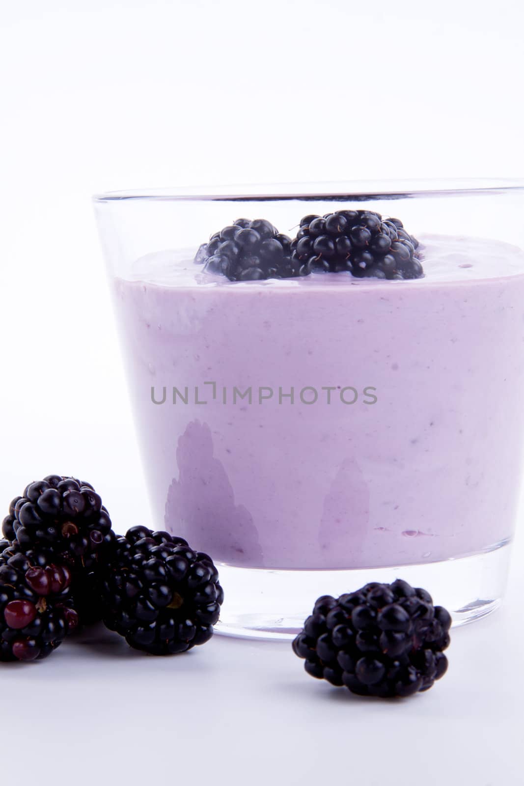 fresh tasty blackberry yoghurt shake dessert isolated on white background