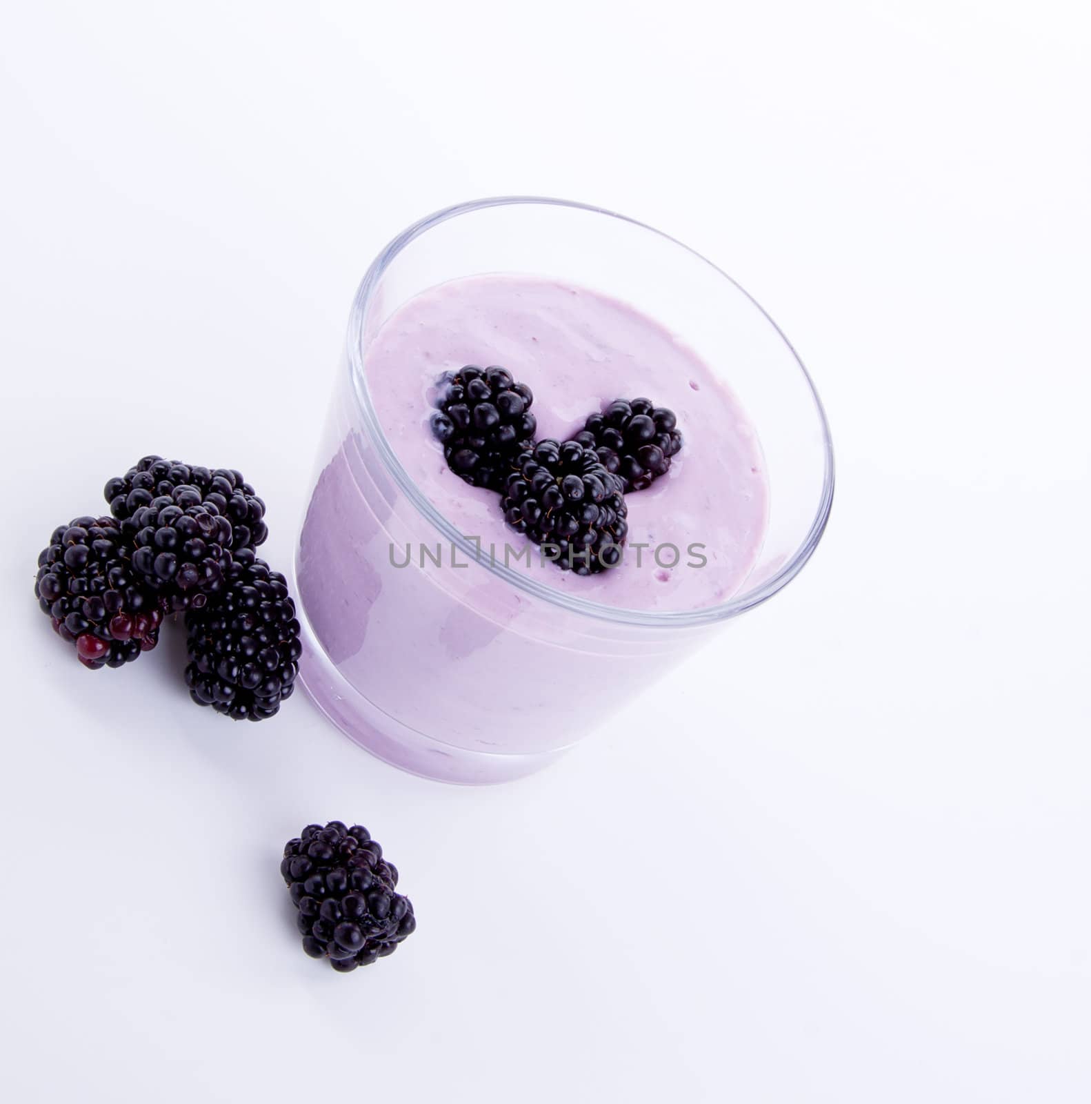 fresh tasty blackberry yoghurt shake dessert isolated on white background