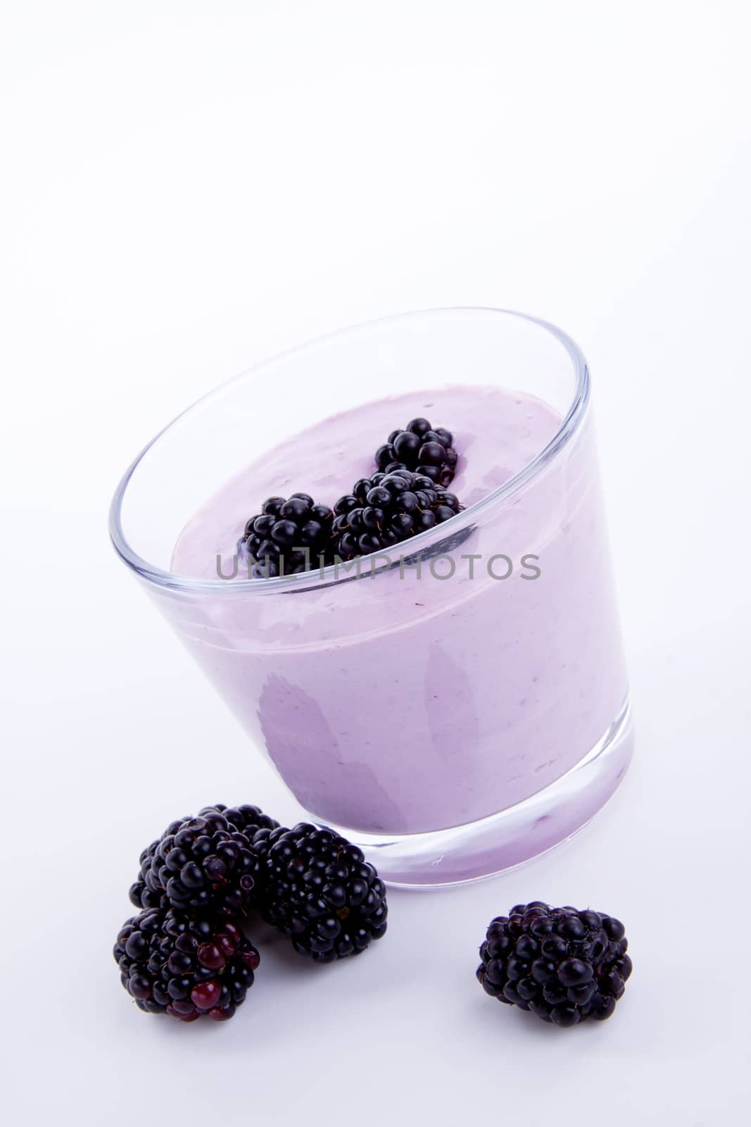 fresh tasty blackberry yoghurt shake dessert isolated on white background