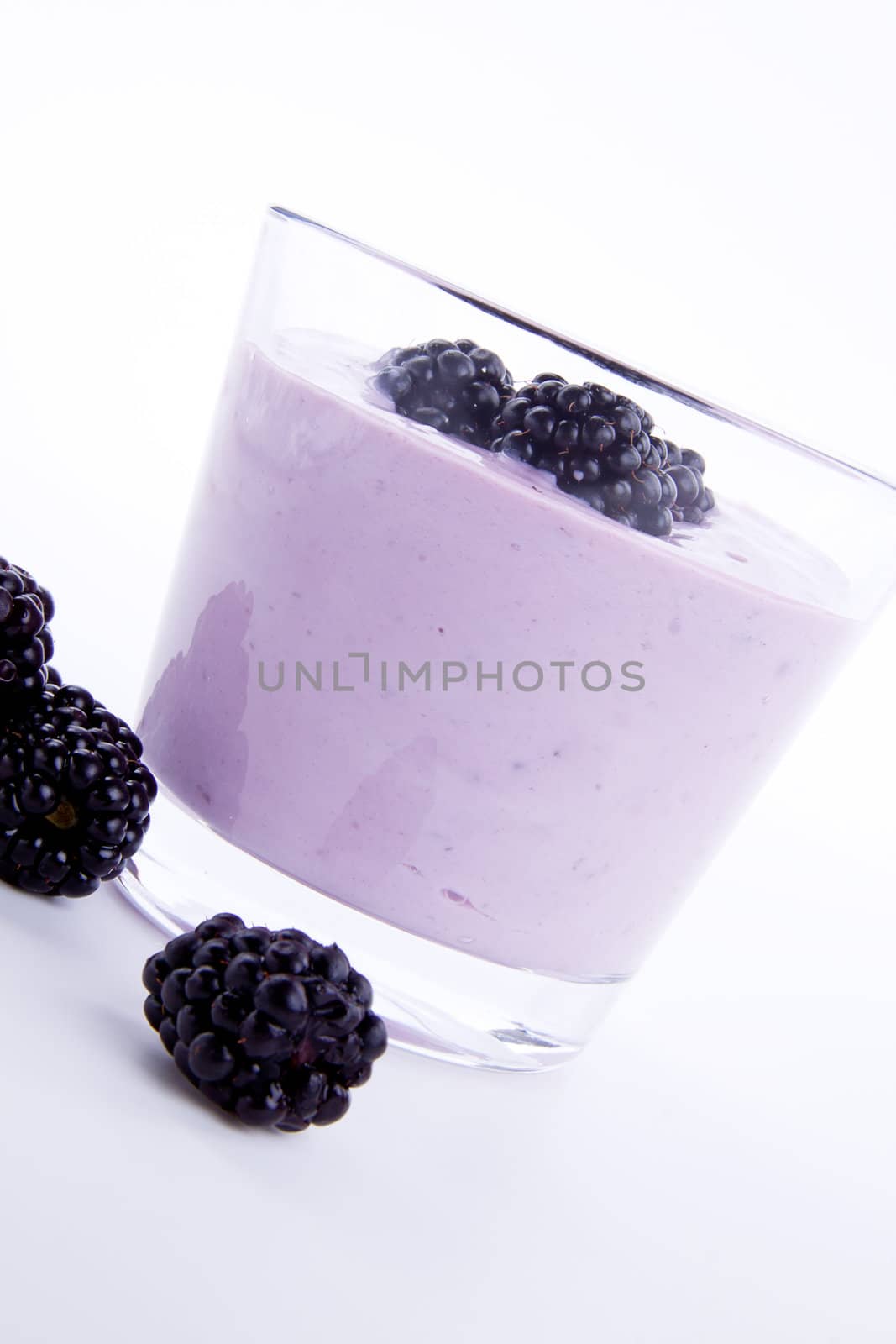 fresh tasty blackberry yoghurt shake dessert isolated on white background