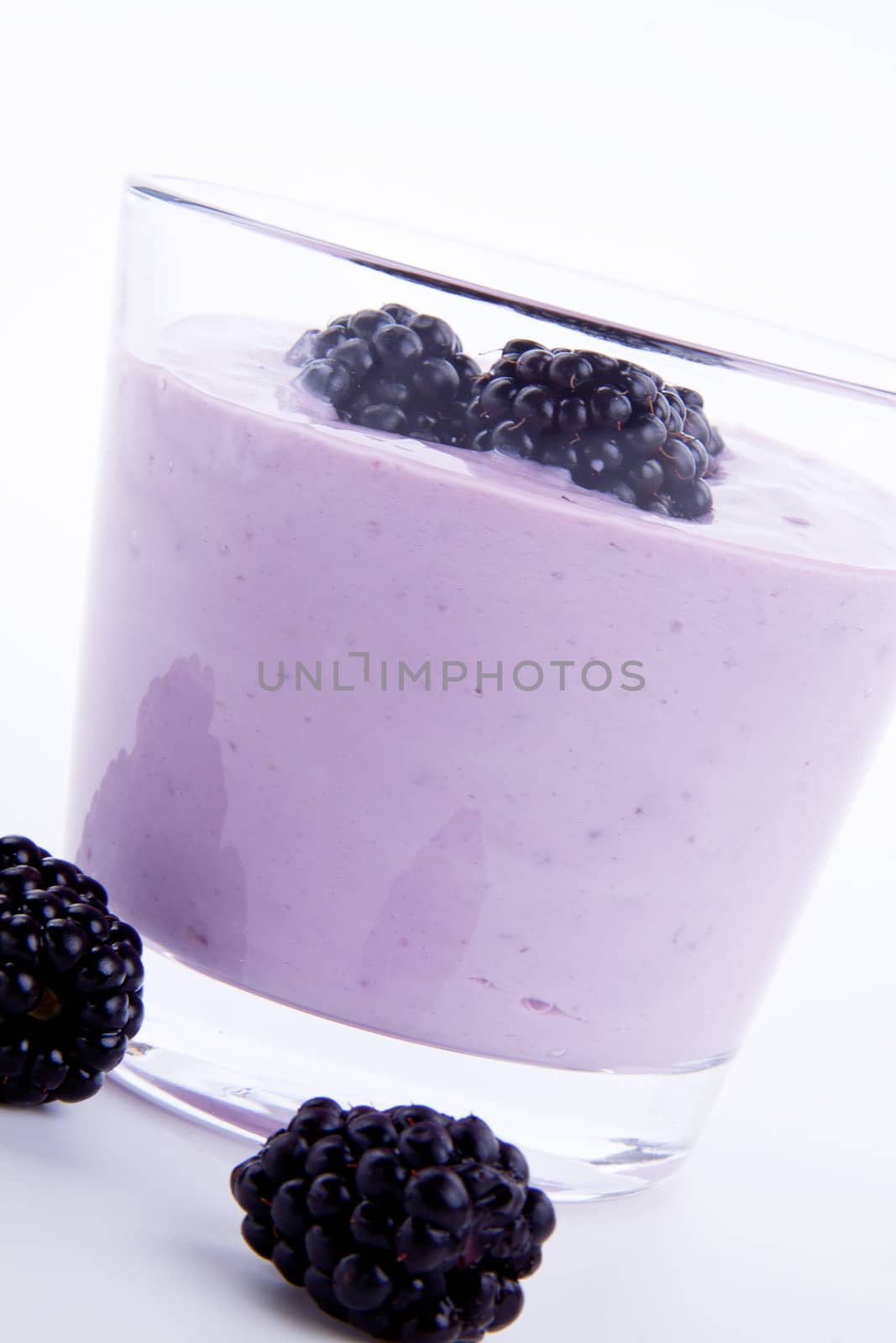 fresh tasty blackberry yoghurt shake dessert isolated on white background