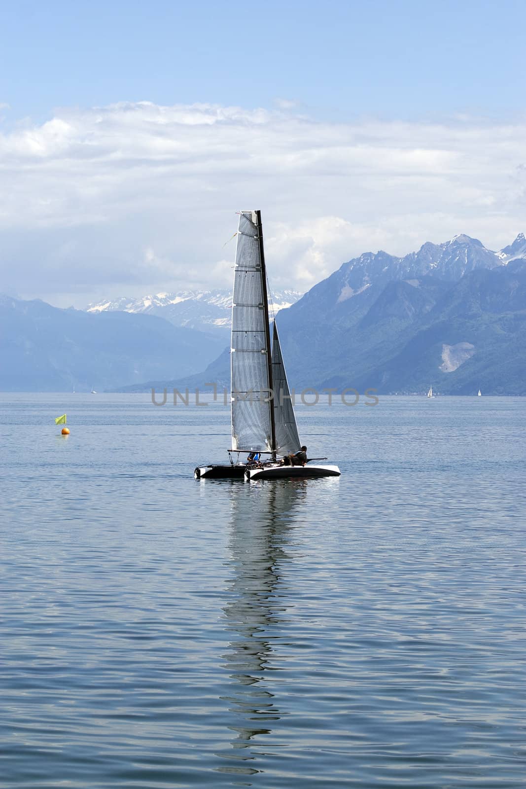 Catamaran sailing on Lake Geneva in Switzerland.