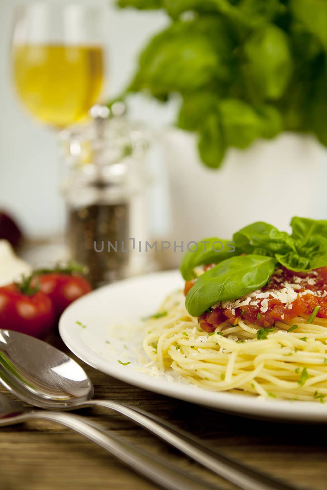 delicious fresh spaghetti with tomato sauce and parmesan on wooden table