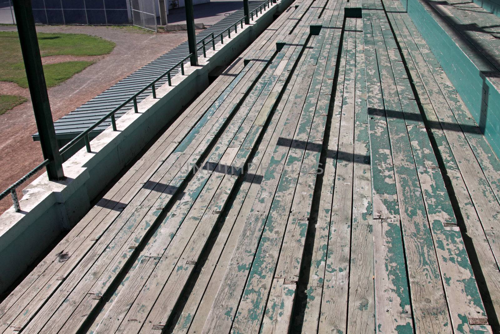 Wooden bleachers at a baseball field.