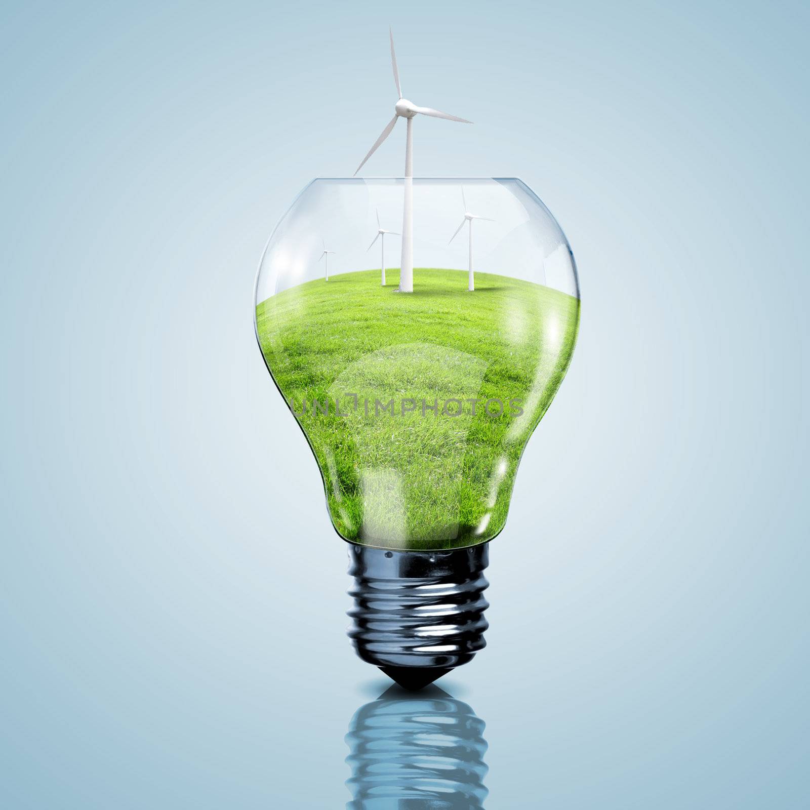 Electric light bulb and wind meels inside it as symbol of green energy