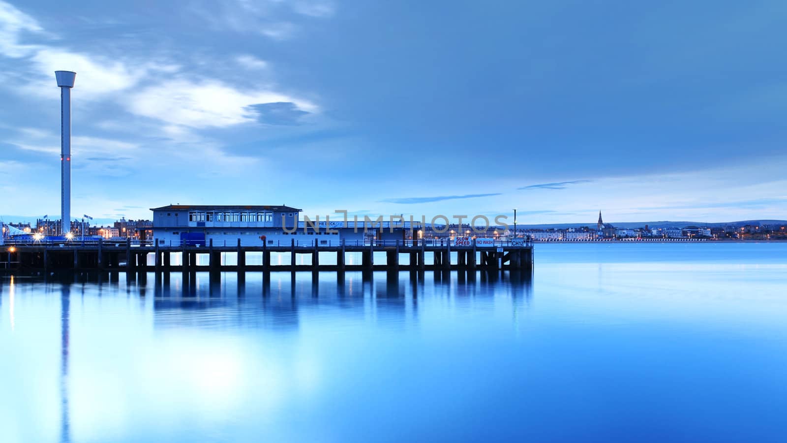 Tranquil sea at the mouth of weymouth harbour in dorset england