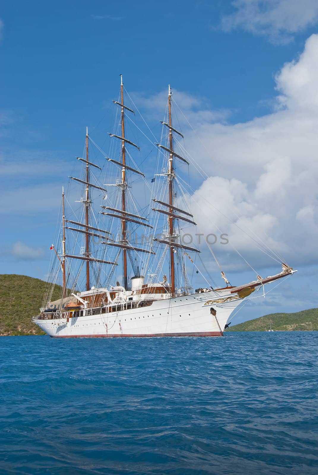 Older 4 masted sailboat at anchor in the caribbean